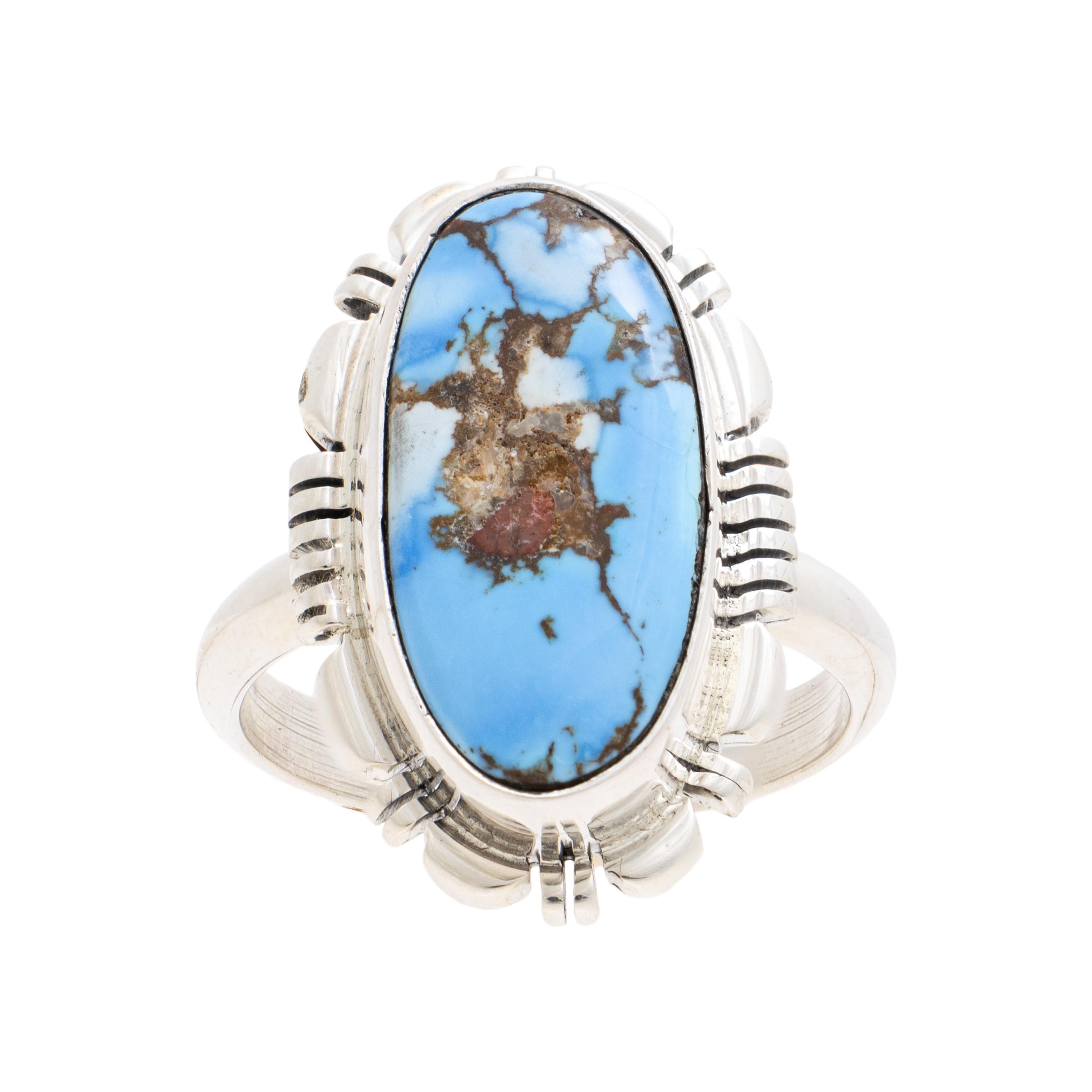 Navajo Golden Hill turquoise and stering ring. Exceptional high grade stone with excellent colors and depth surrounded by classic sterling border. Stamped 