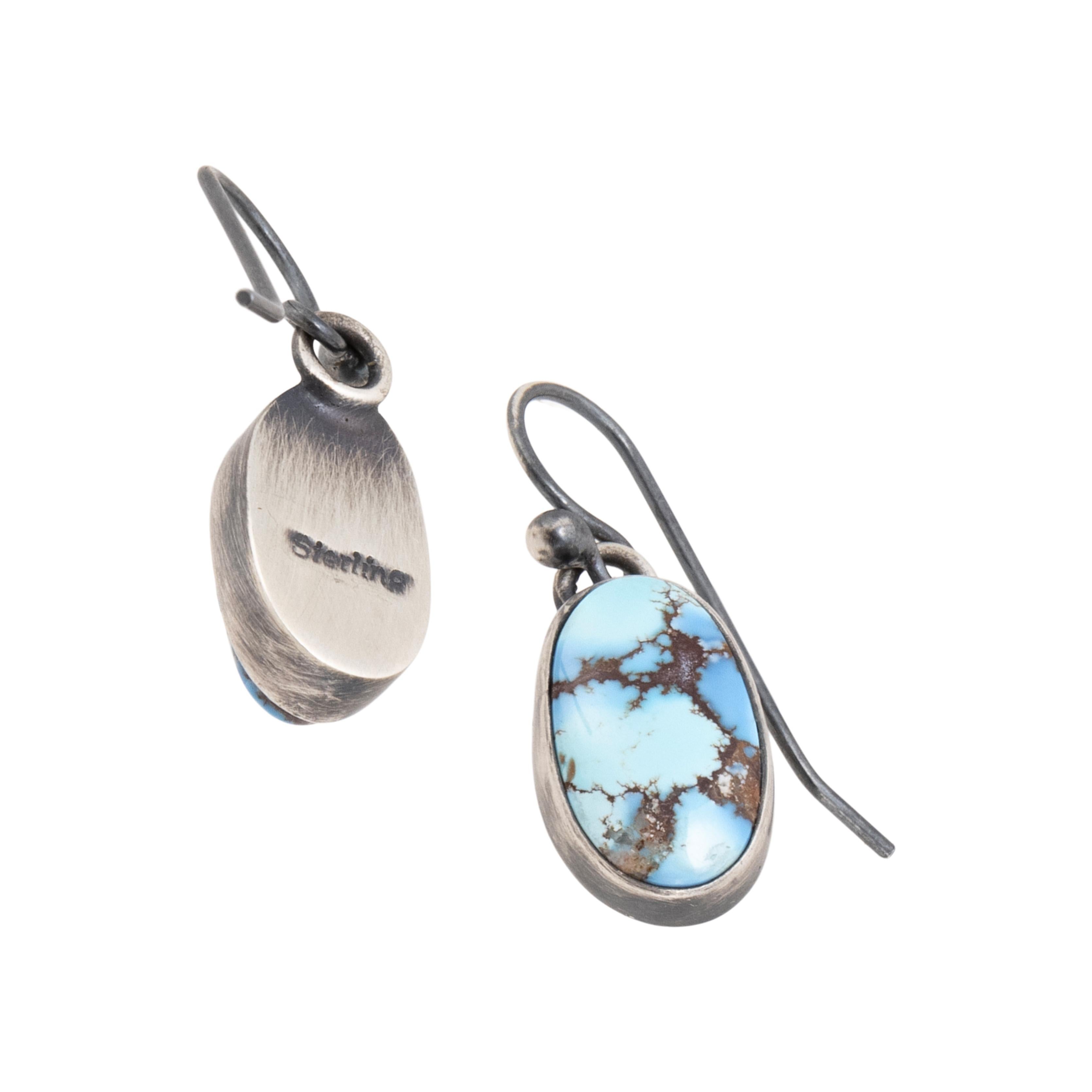 Navajo Golden Hill turquoise and sterling silver dangle earrings in an oval shape. Single grade A quality, natural untreated stone with great depth on sterling post. Made by Navajo silversmith Angela Martin. Stamped sterling with maker's hallmark.