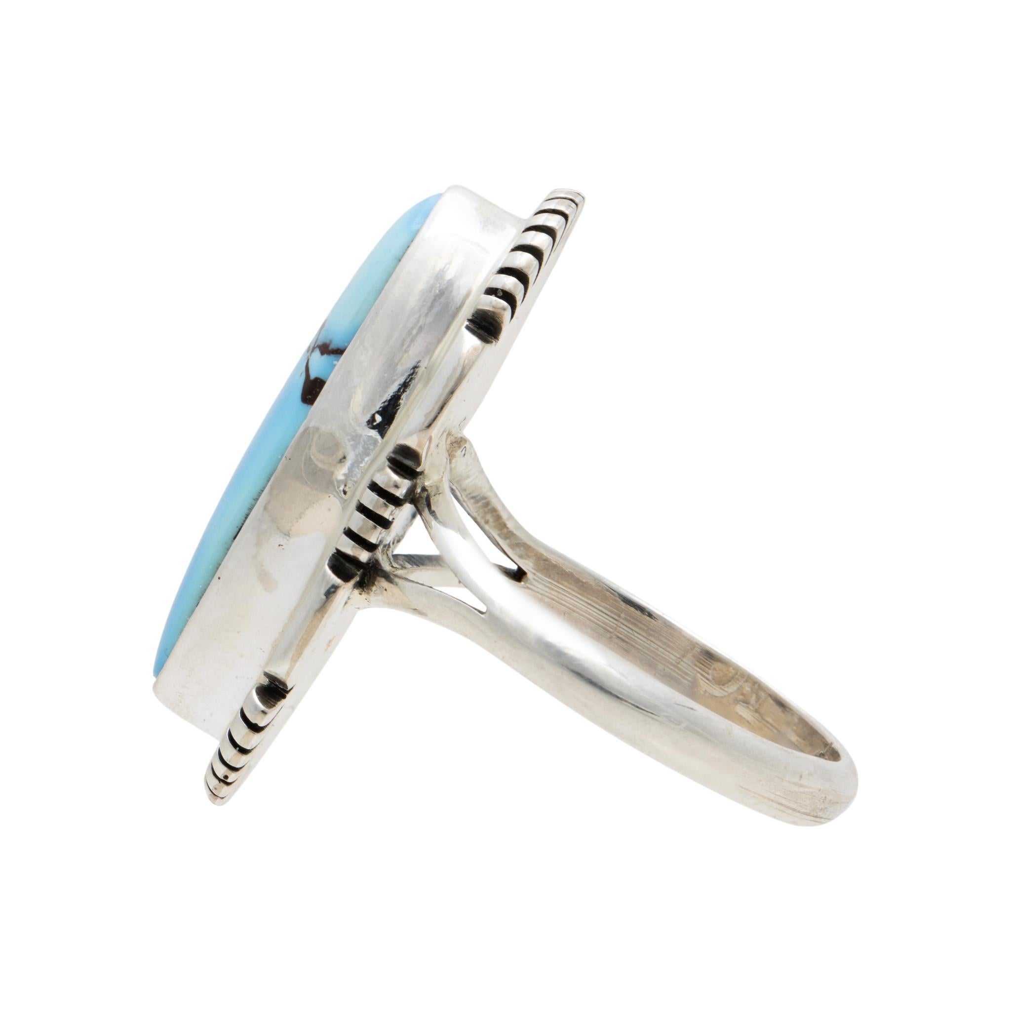 Navajo Golden Hill turquoise and sterling silver ring. Exceptional high grade stone with excellent colors and depth surrounded by classic sterling border. Desert Lavender, or Golden Hill Turquoise is one of the most distinct-looking turquoise pieces