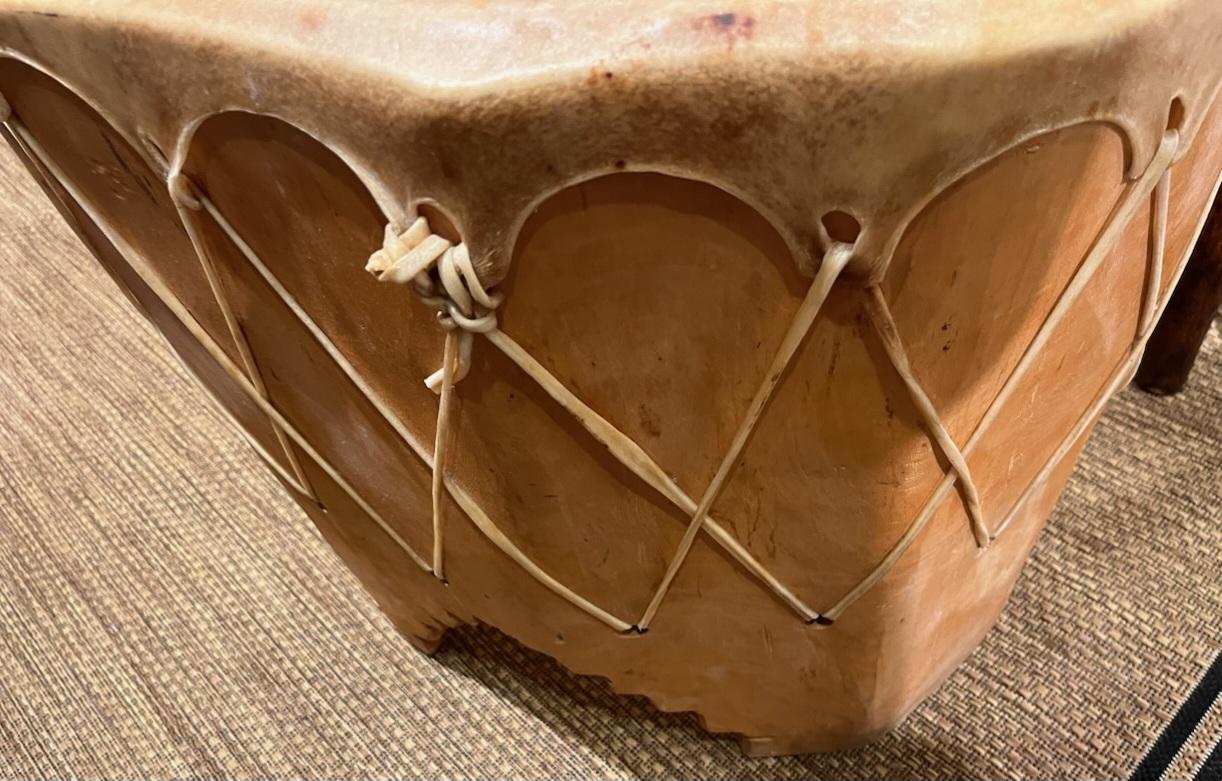 Navajo Indian drum table from Taos, New Mexico all handmade circa 1945 to 1950 in fine condition with animal skin or cow skin stretched top and cut out legs
size is 24 deep by 22 wide by 22 high fantastic condition