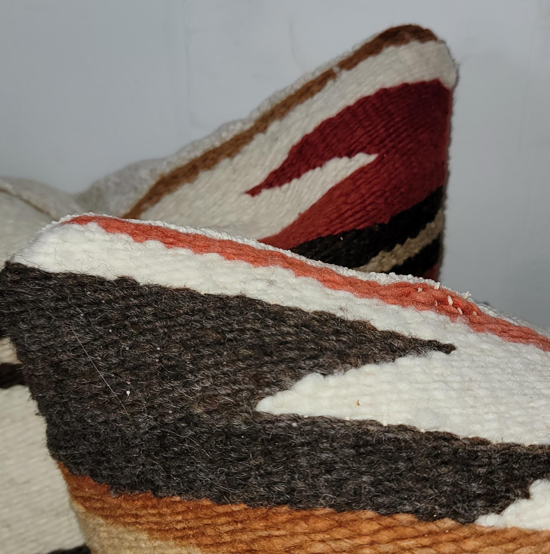 Navajo Indian eye dazzler weaving pillows - pair. Off white Chenille backing and zippered shams. Down and feather inserts.
Measures: 18 x 17.