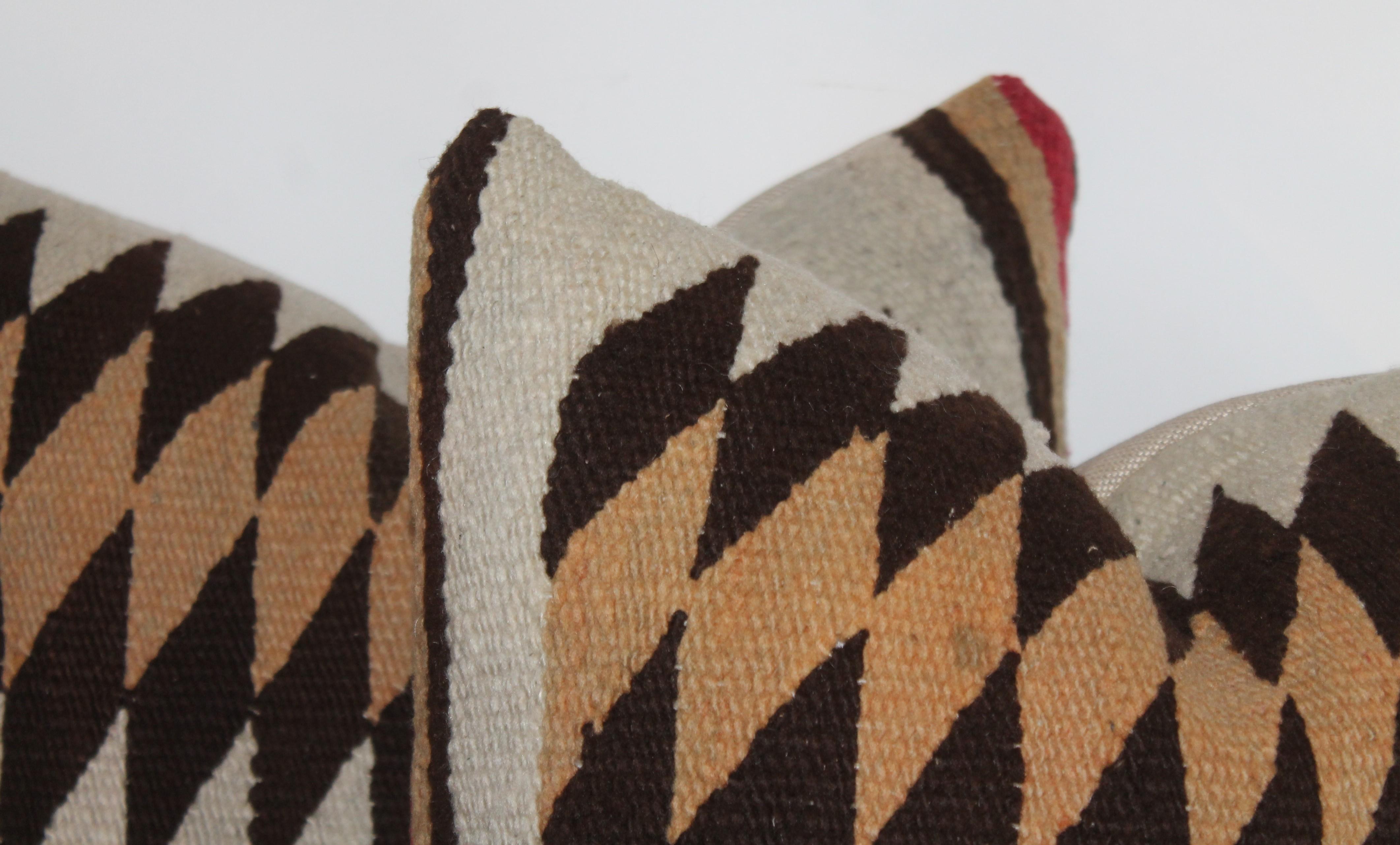 This fine pair of Navajo Indian weaving pillows are in fine condition and have cotton linen backings. Sold as a pair.