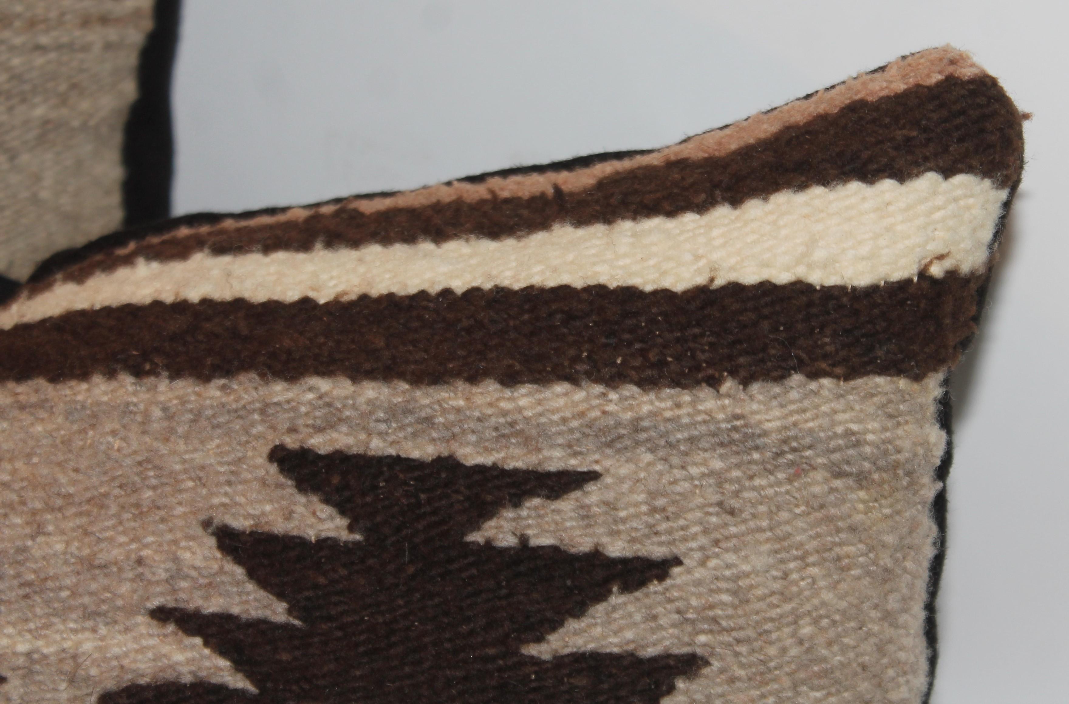 Navajo Indian weaving geometric bolster or kidney pillows . These eye dazzlers are fantastic and in very good condition.