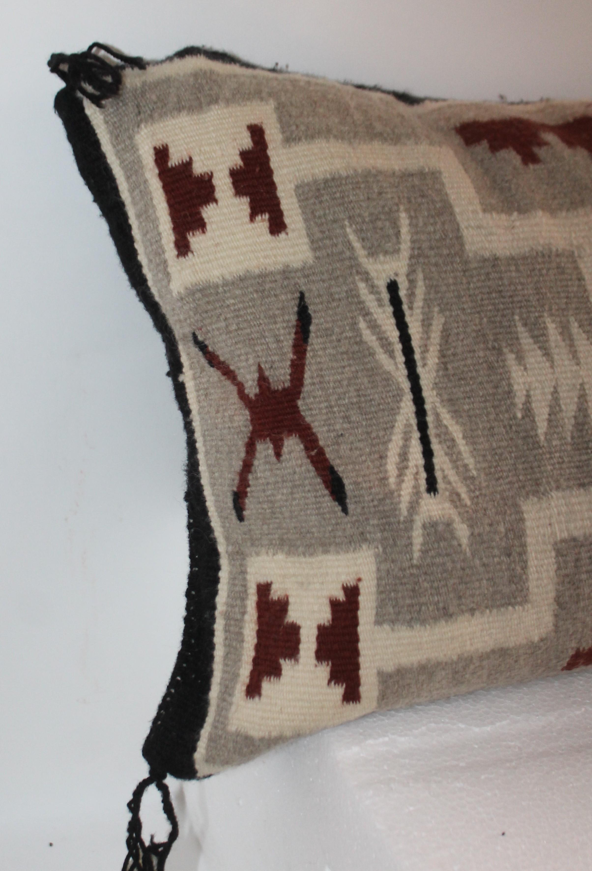 This fine handwoven Navajo Indian weaving pillow is in mint condition. The backing is in a cotton linen. Down & feather fill.