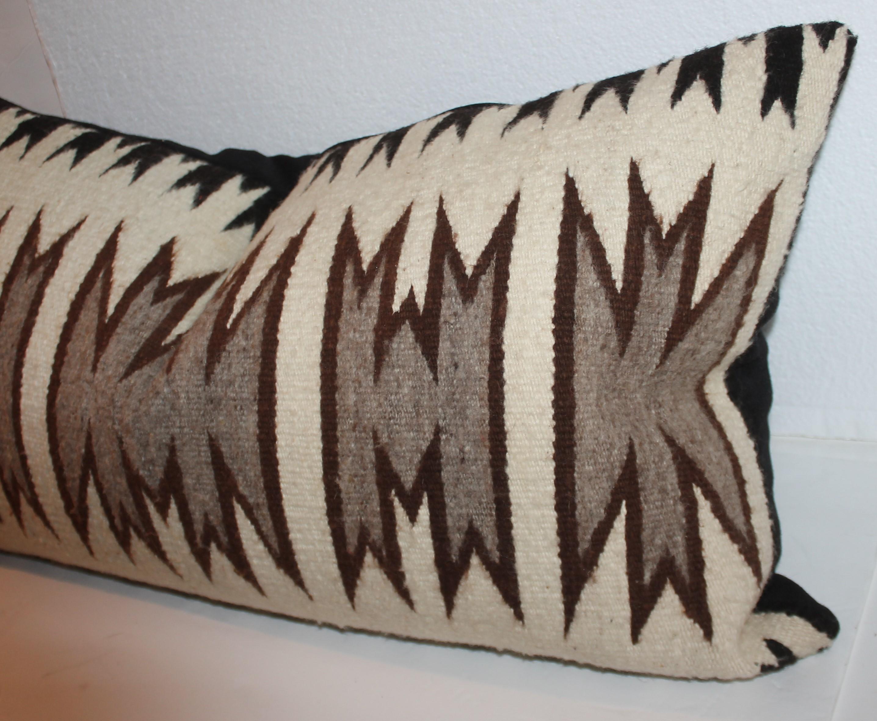 Navajo Geometric saddle weaving pillow. The color is black & cream with grey back round bolster weaving pillow. The insert is down & feather fill with a black cotton linen backing.