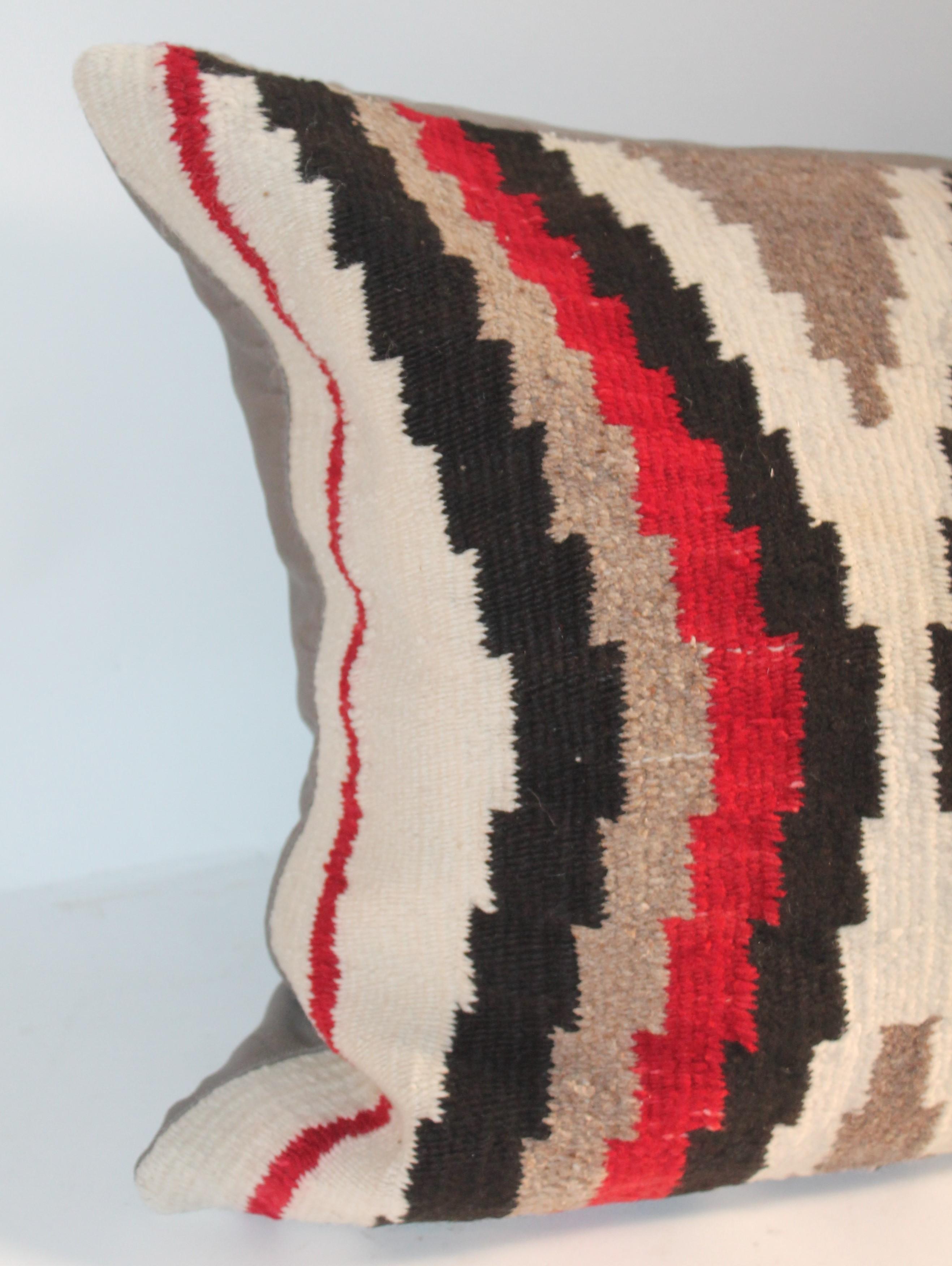 This geometric Navajo Indian weaving is in fine condition. The backing is in cotton linen. Single Pillow. We have a set of three all sold individually.