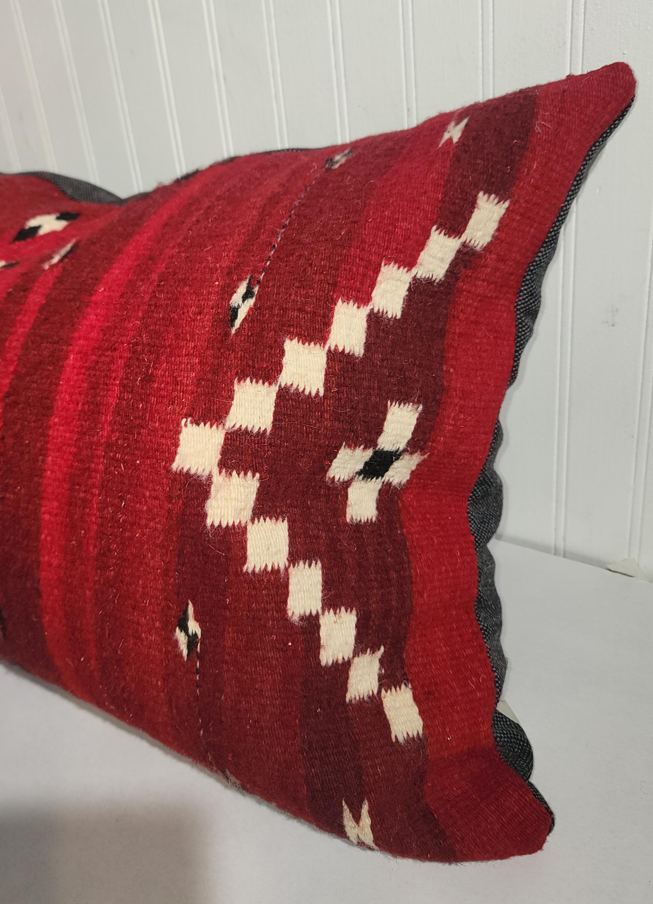 Hand woven Navajo weaving bolster pillow.This was a saddle blanket weaving made into a pillow.