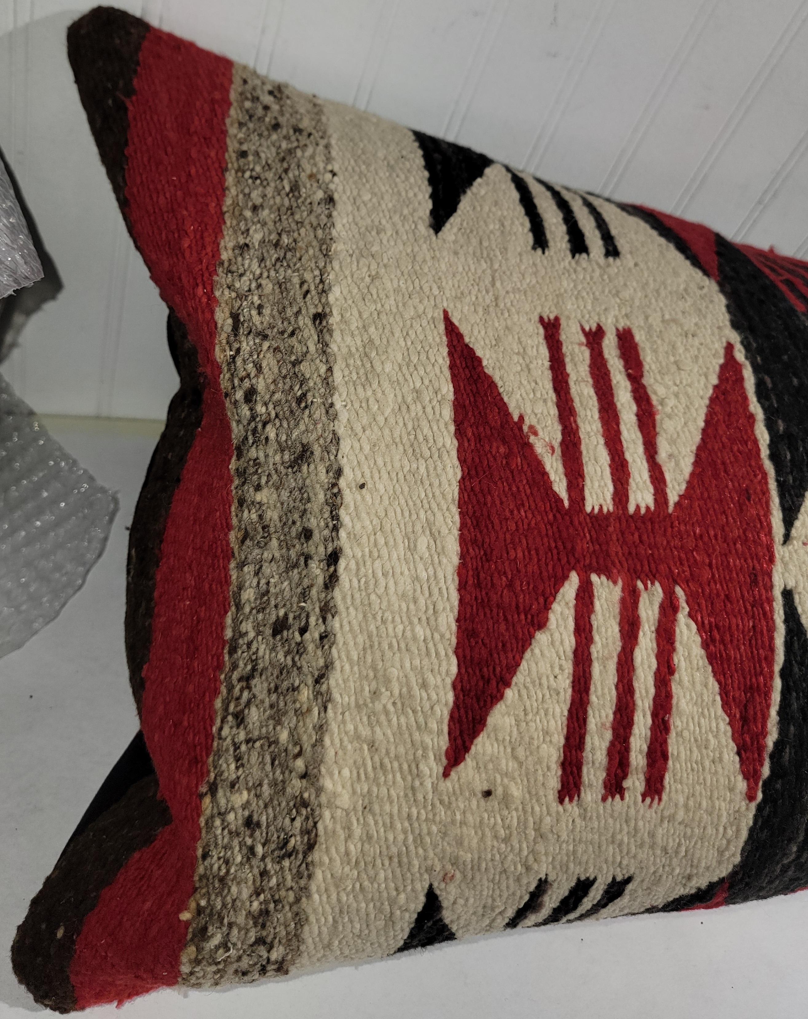 Geometric Navajo Indian weaving bolster pillow with tan suede leather backing.The insert is down & feather fill.