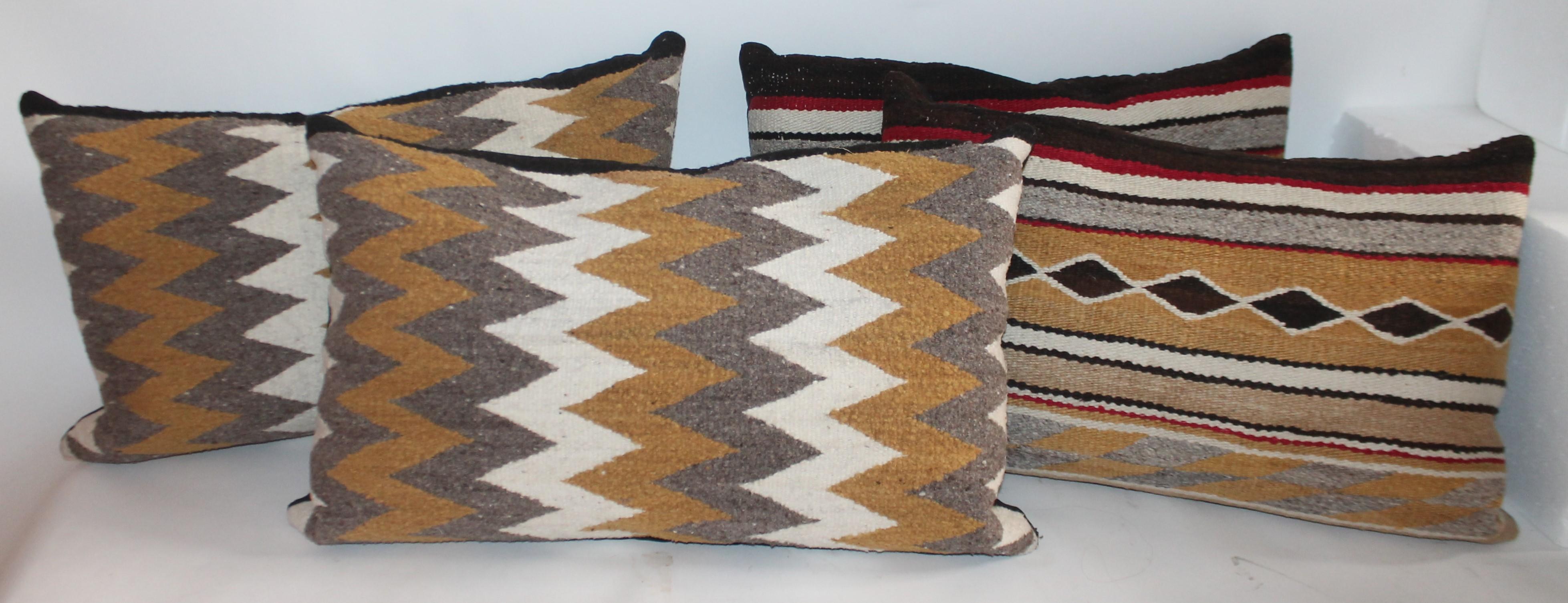 These fine Navajo Indian weaving pillows are being sold in a group of four pillows. One pair is streak of lighting pattern and second pair is diamond bars. Both pairs are normally 995.00 a pair. Special deal is for both pairs.