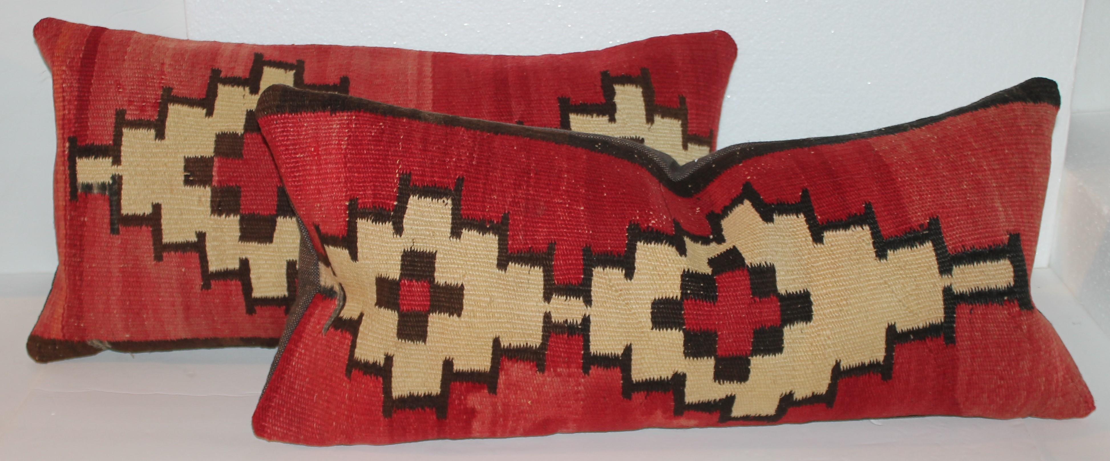 Early Navajo Indian weaving pillows with chocolate cotton linen backings. These pillows are in fine condition. They are newly made pillows from vintage antique Navajo weaving's.