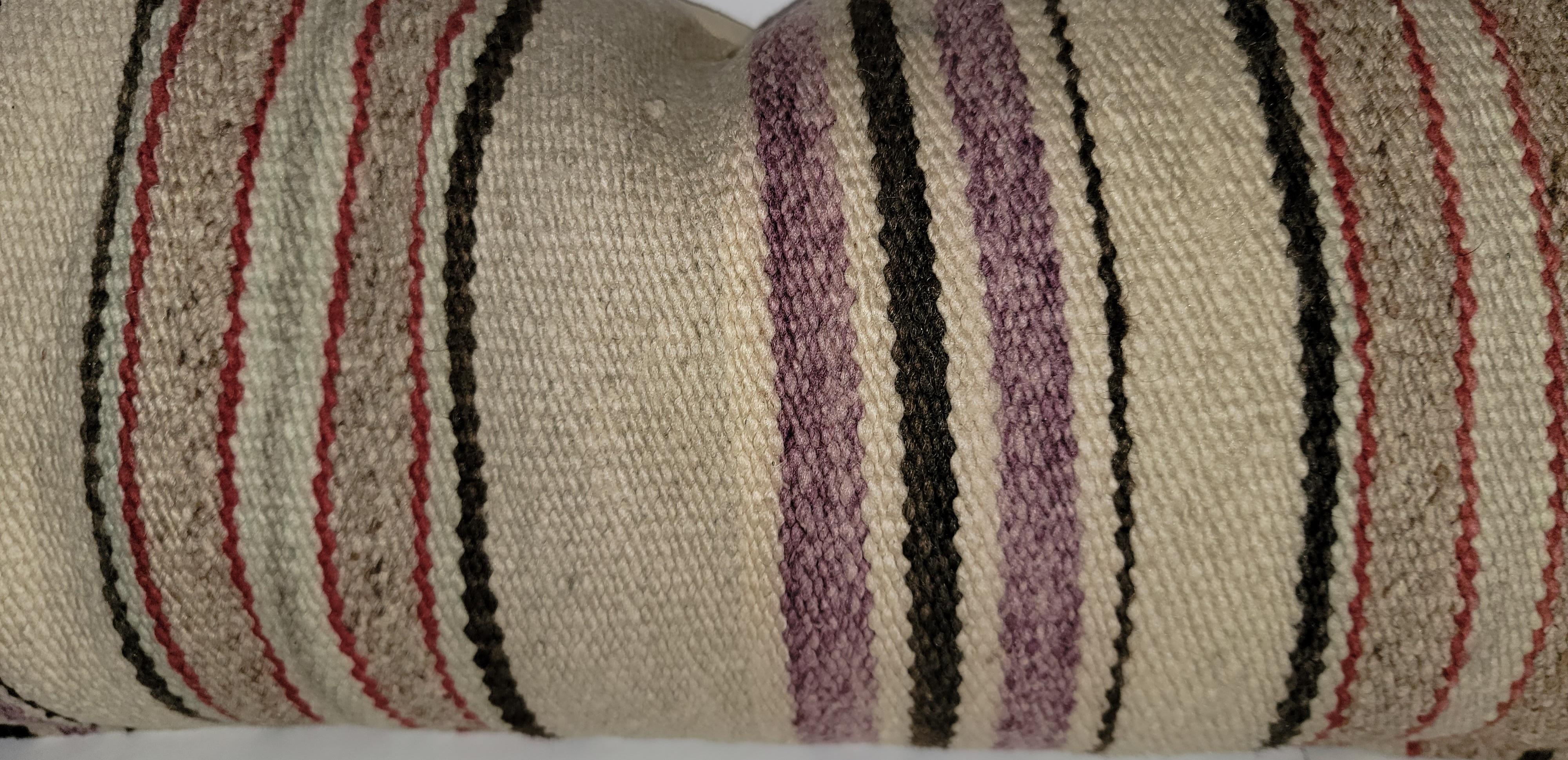 Navajo Indian weaving bolster pillows - pair feather and down insert and zippered case. Colors: Black, off white, tan, and purple.
