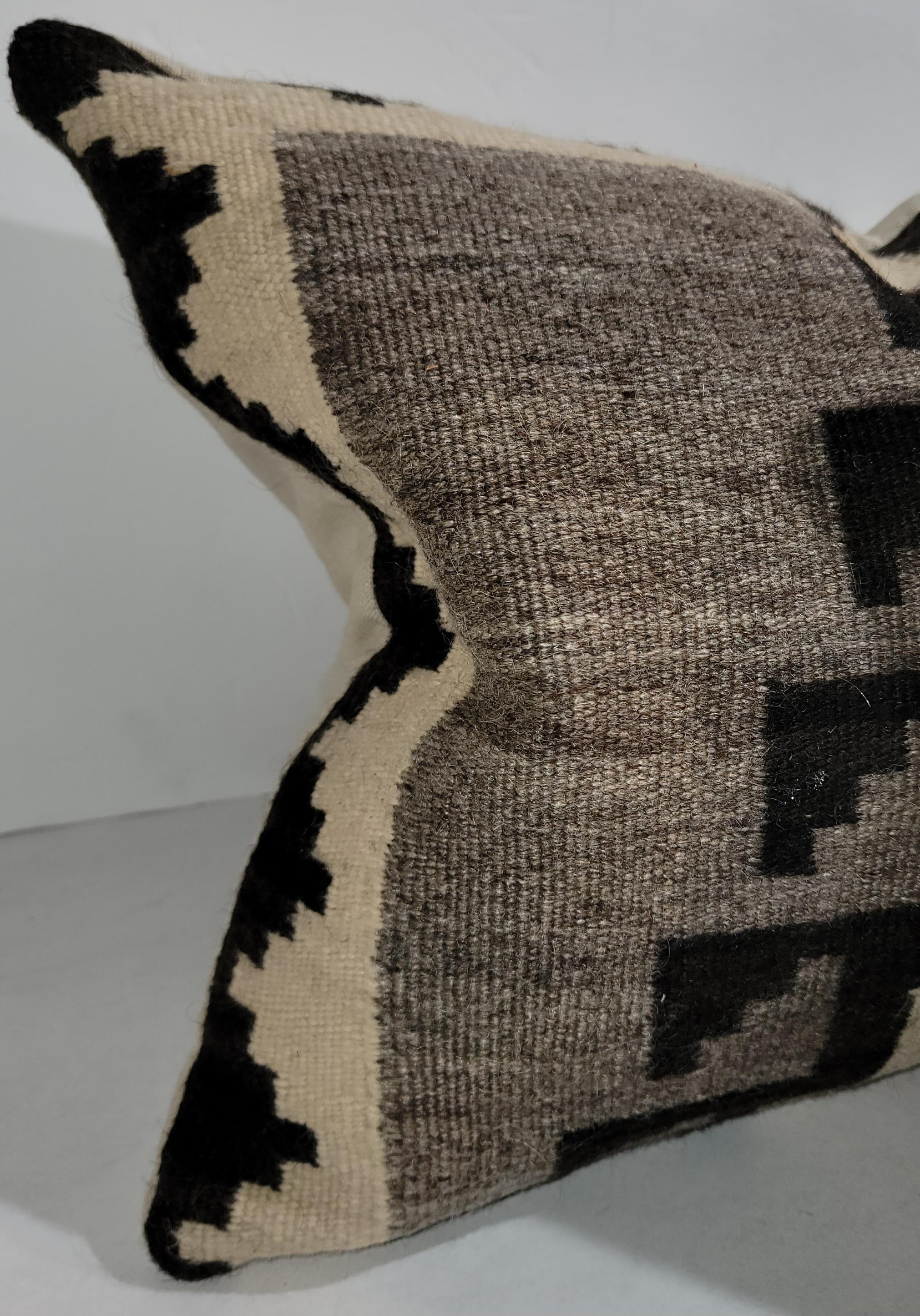Early 20thc Navajo Indian weaving (saddle blanket )pillows in fantastic condition.The backings are done in a cotton linen.