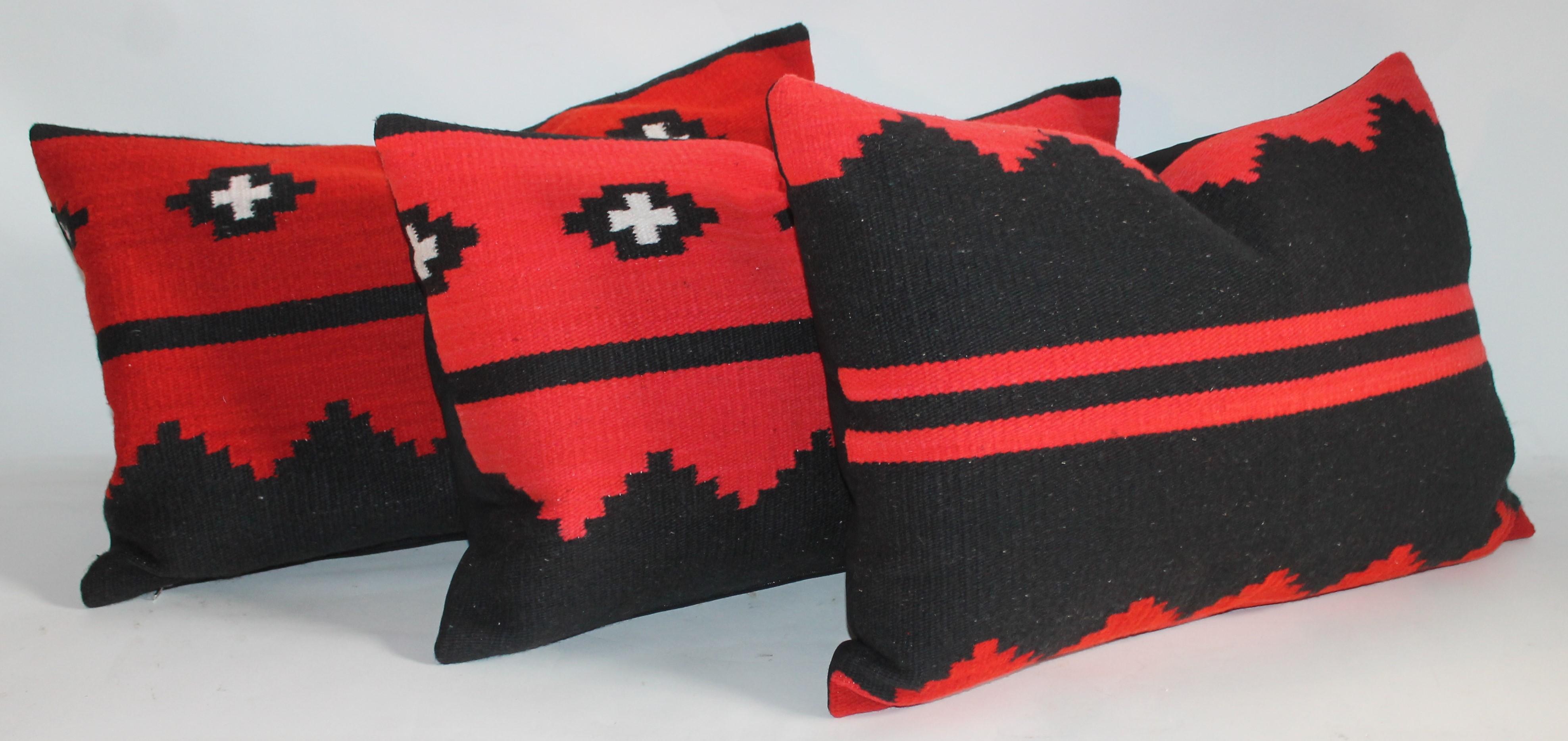 These three Navajo Indian weaving bolster pillows are from a saddle blanket. Selling as a group of three or $875. each. The condition are very good with black cotton linen backings.