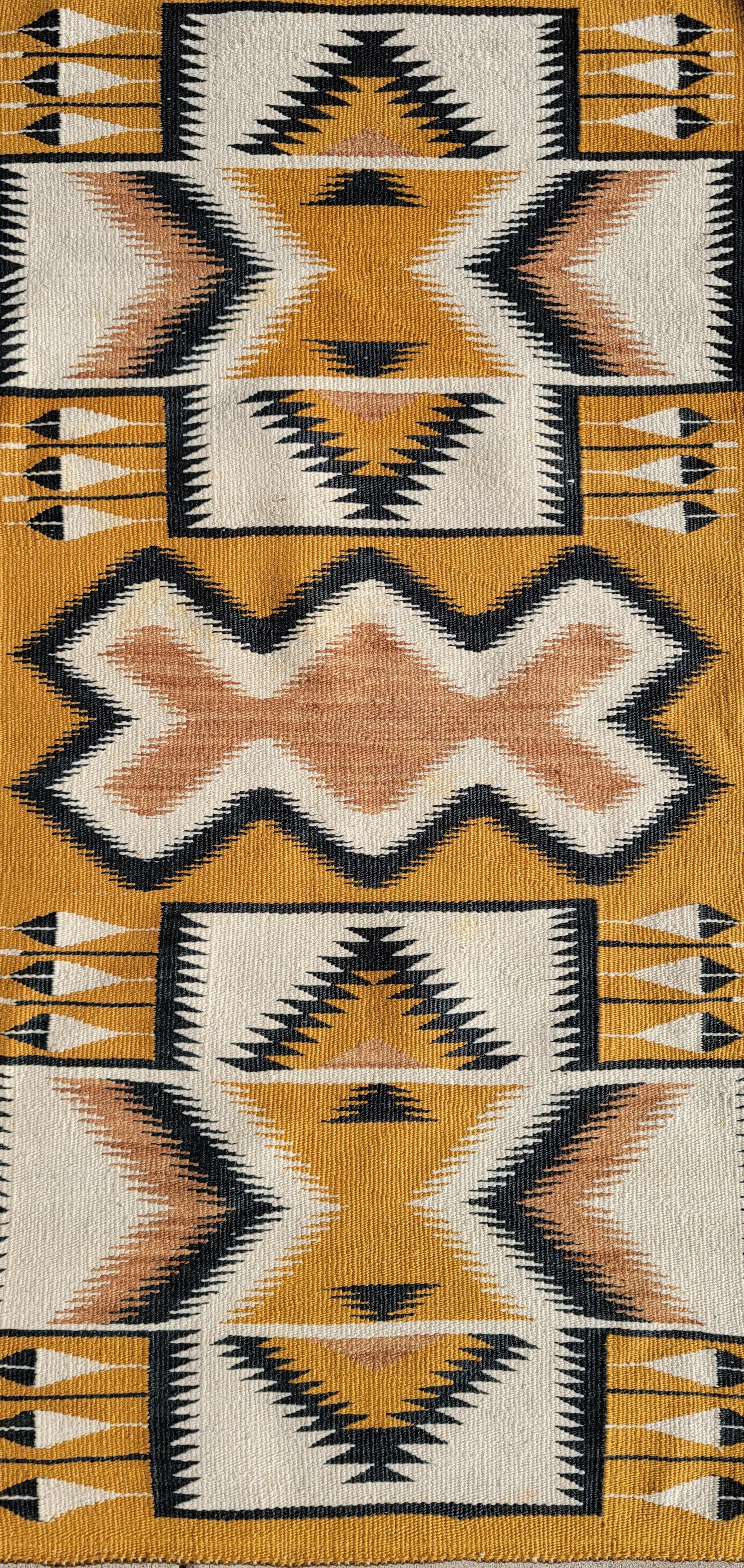 This amazing geometric Navajo Indian weaving made by the Chinle tribe.Notice the black feathers and amazing geometric pattern.
