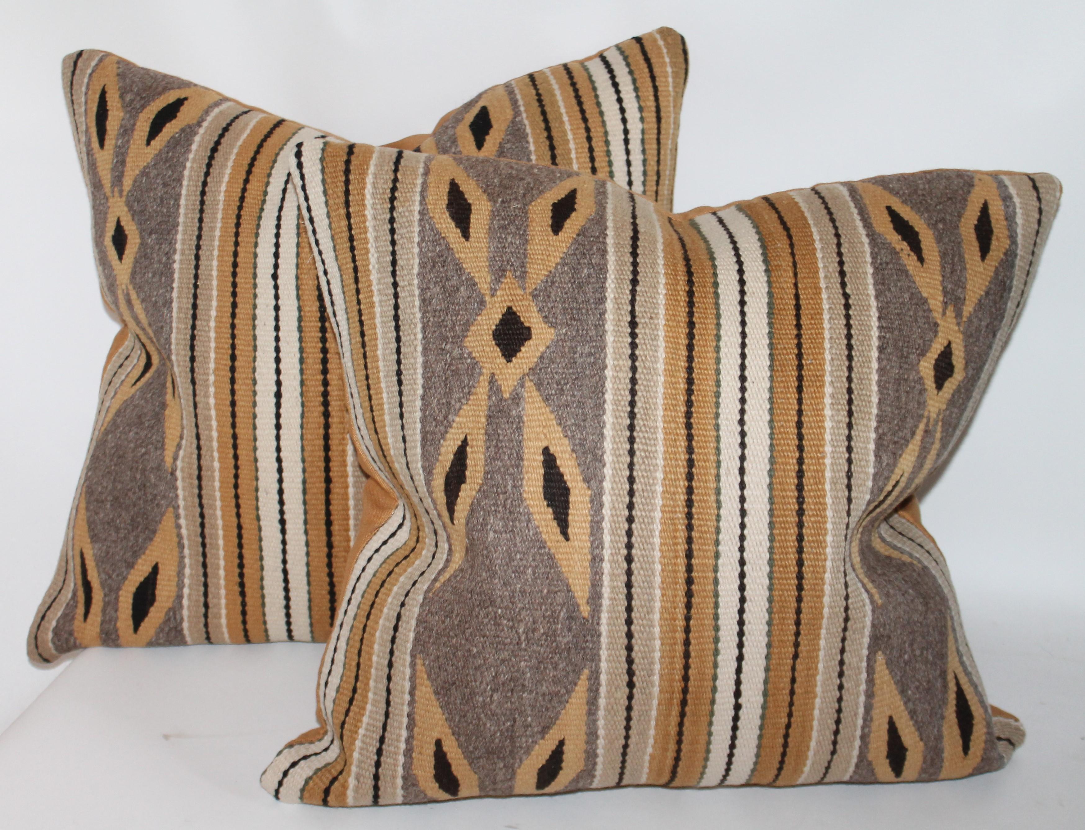These fine Navajo Indian weaving pillows are sold as pairs. There are two pairs in stock. They are in fantastic condition.