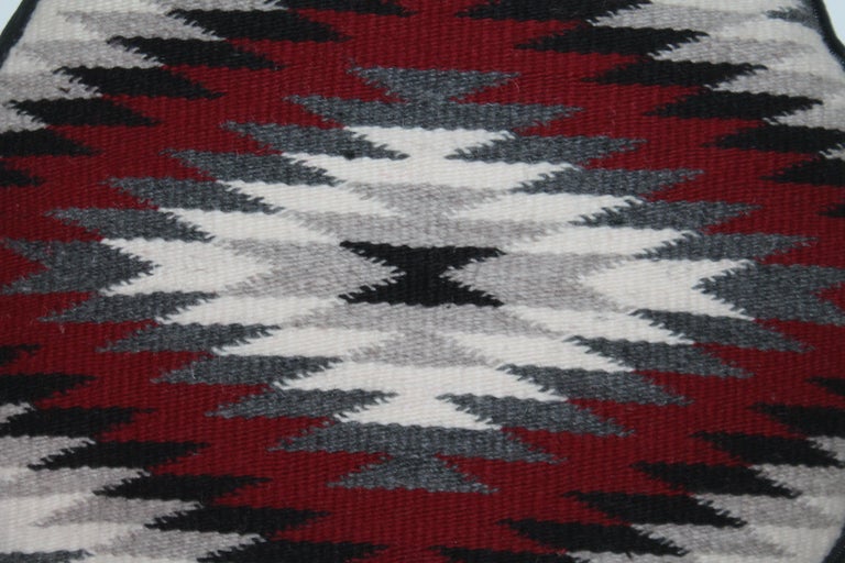 Navajo Indian weaving cushion with black linen backing. This seat cushion is two inches thick and down & feather fill.