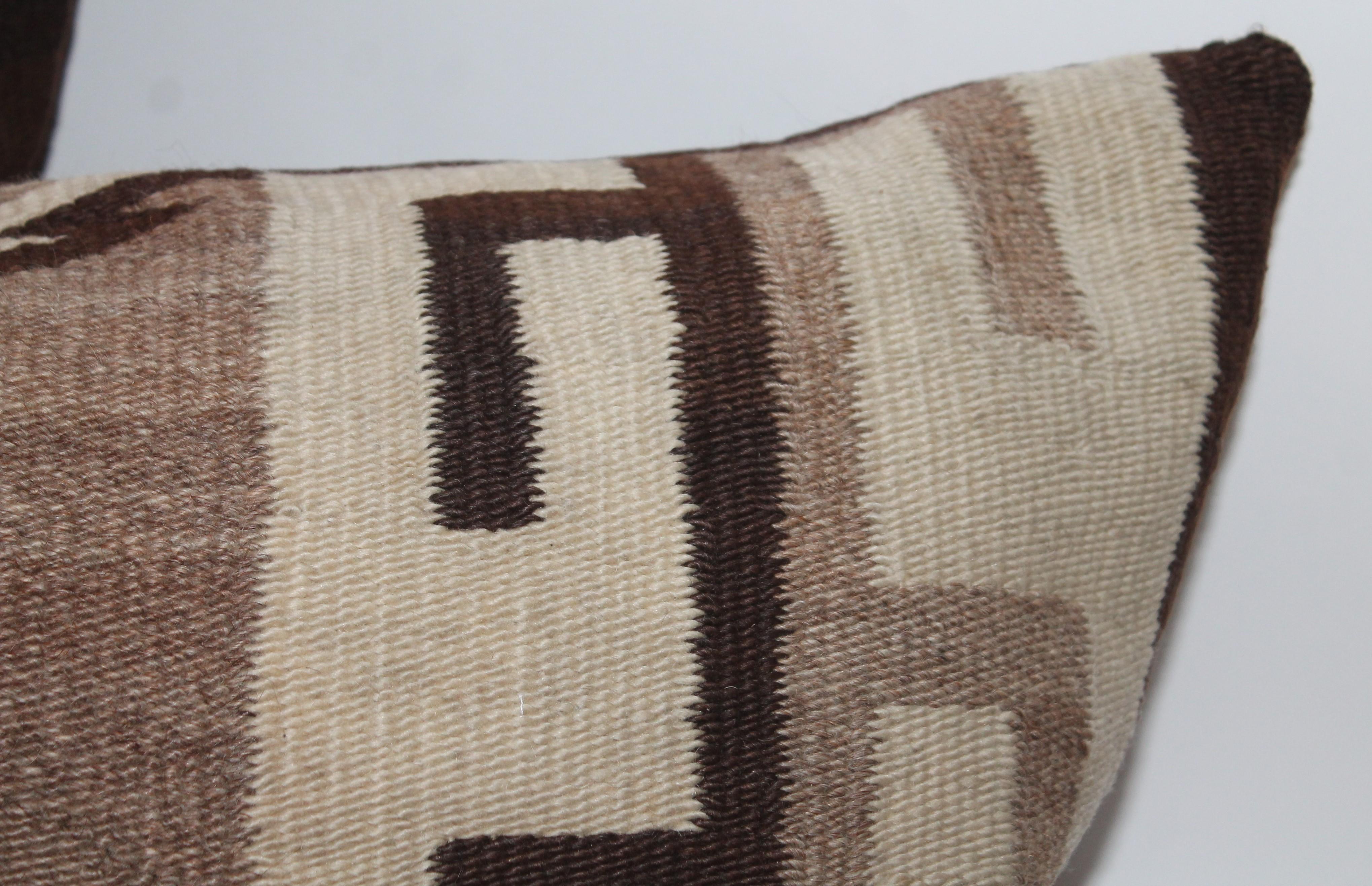 Navajo Indian weaving bolster pillow with brown cotton backing. This diamond pattern weaving pillow is in fine condition and is oversized.