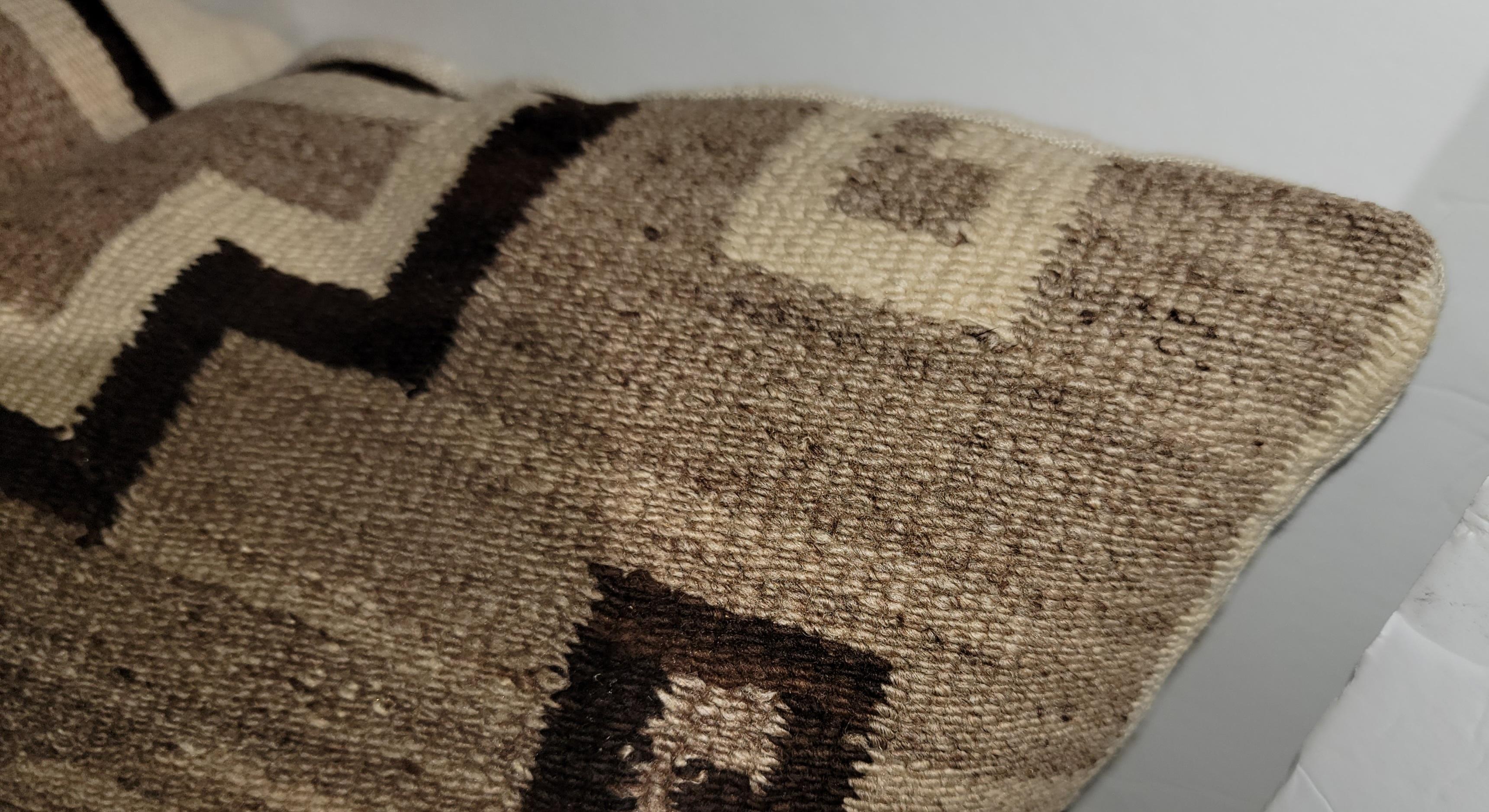 This fine & early Navajo Indian weaving bolster pillow is in fine condition.The backing is in a cotton linen.This is a early 1900 weaving.The insert is down & feather fill.