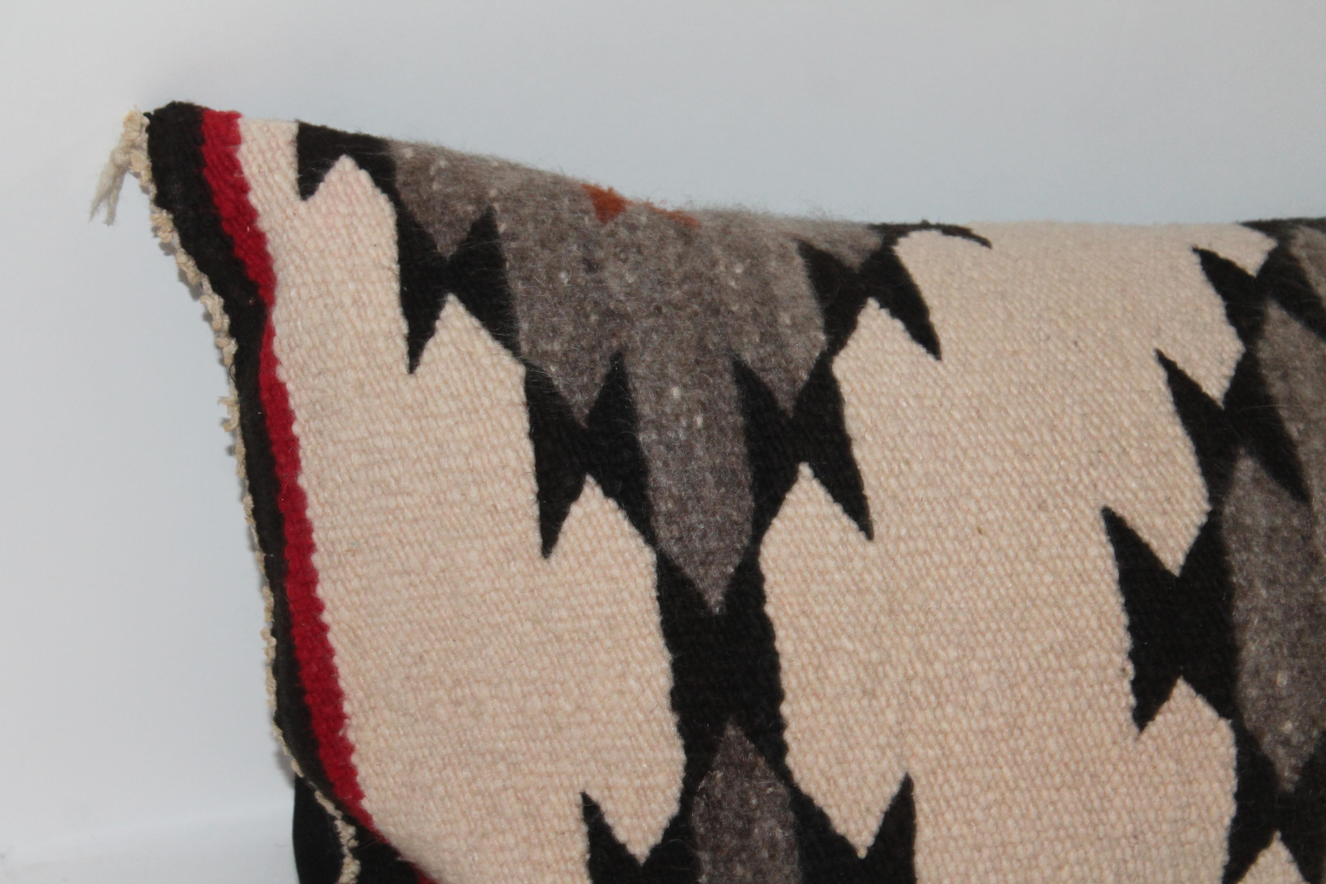 This geometric bolster weaving is in great condition and has a black linen backing.