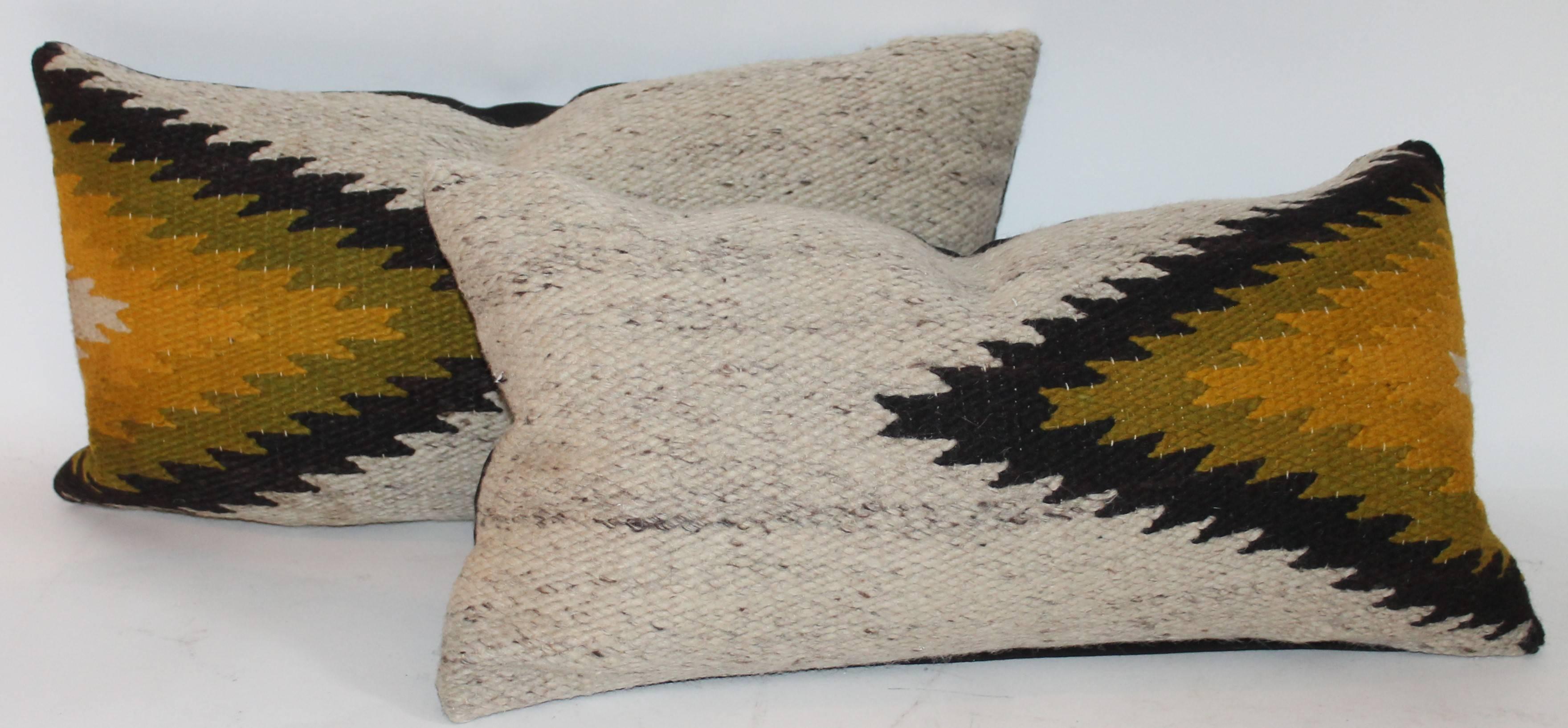 This pair of pillows measure 22 x 14. They are in good condition and have black cotton linen backings.

 