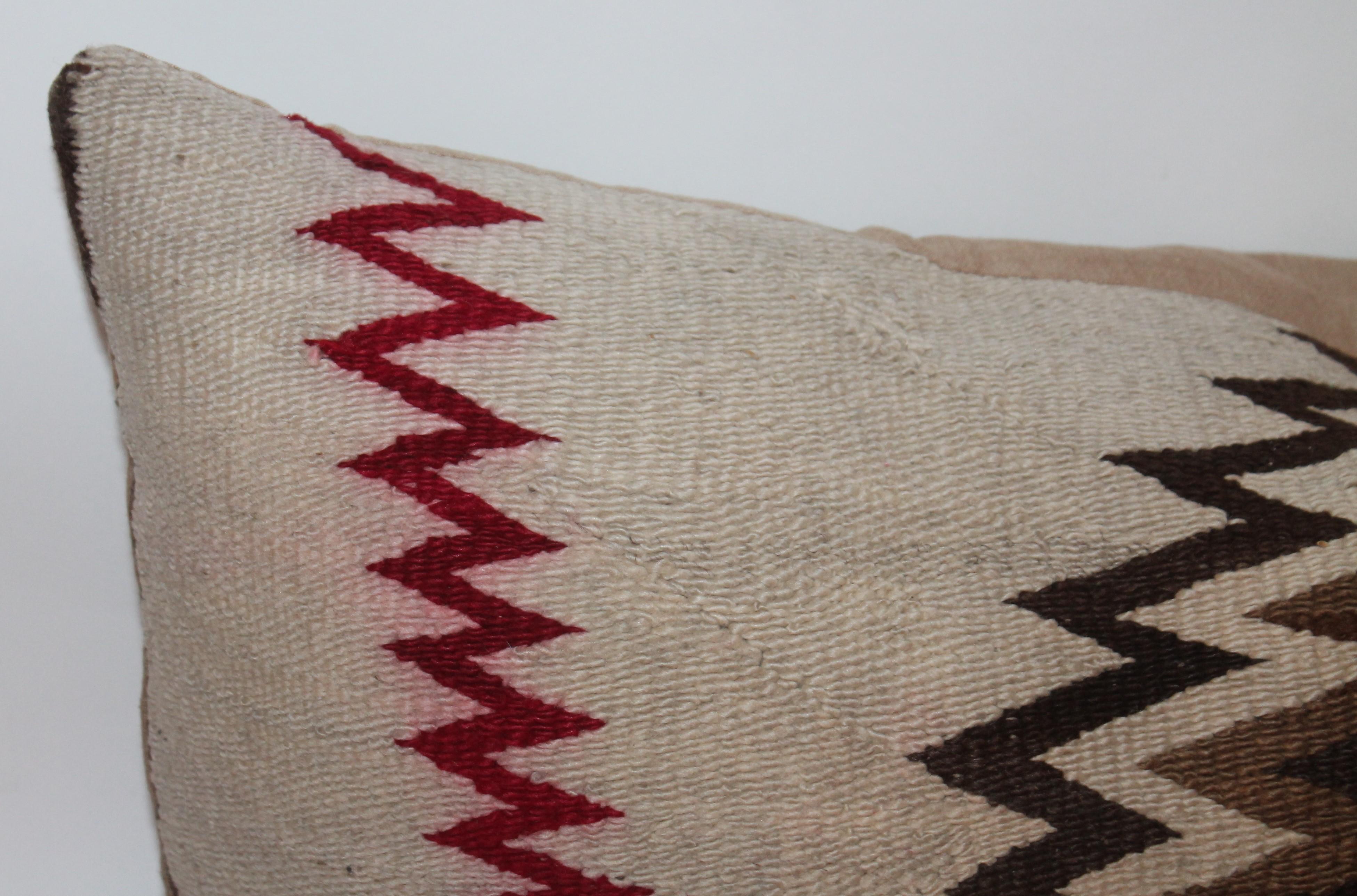 These amazing early 20th century Navajo Indian weaving bolster pillows are in great condition with cotton linen backings. The inserts are down and feather fill.
The geometric design is quite unique and graphic. Sold as a pair!
Smaller pillow