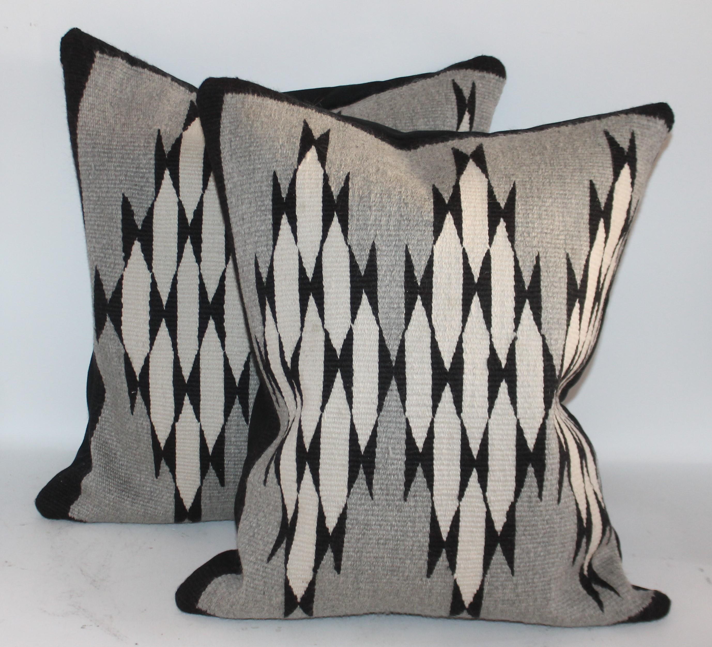 These black and white with a grey ground are so unusual for Navajo weaving's. These pillows have a black cotton linen backing. The condition are pristine. Sold as a pair.