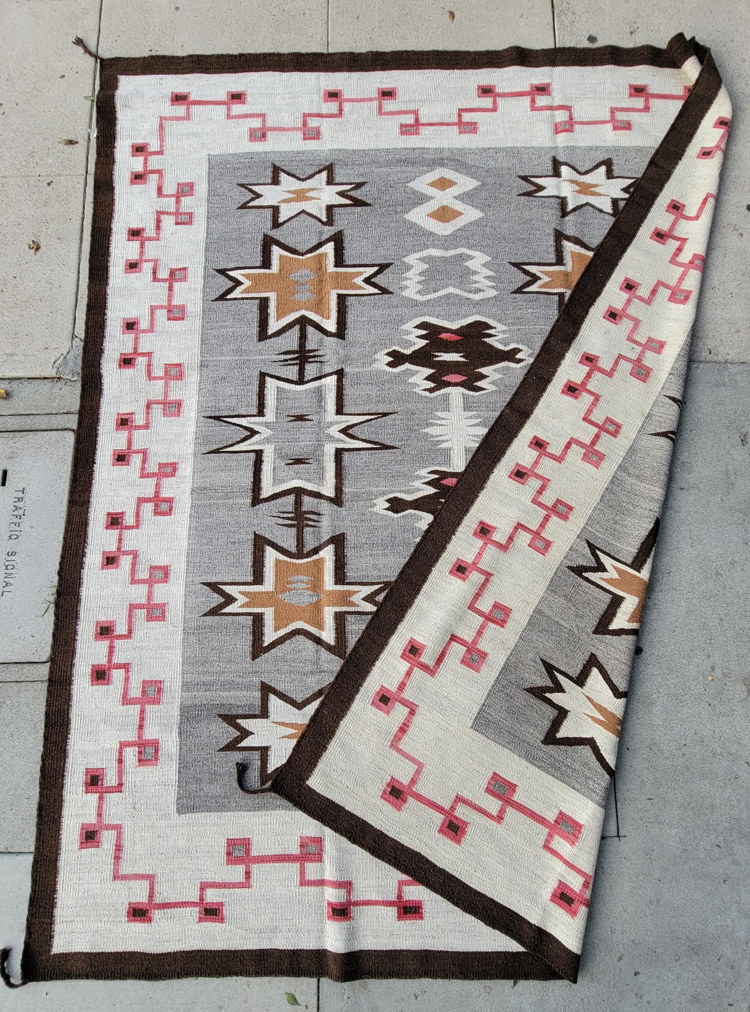 This amazing large hand woven Navajo Indian weaving rug is in fine condition. The lazy lines can be seen in corners and sides.This is a fantastic new woven rug. It is 8 x 10 or ( 96 x 120 ). These rugs are so very hard to find for reasonable and in