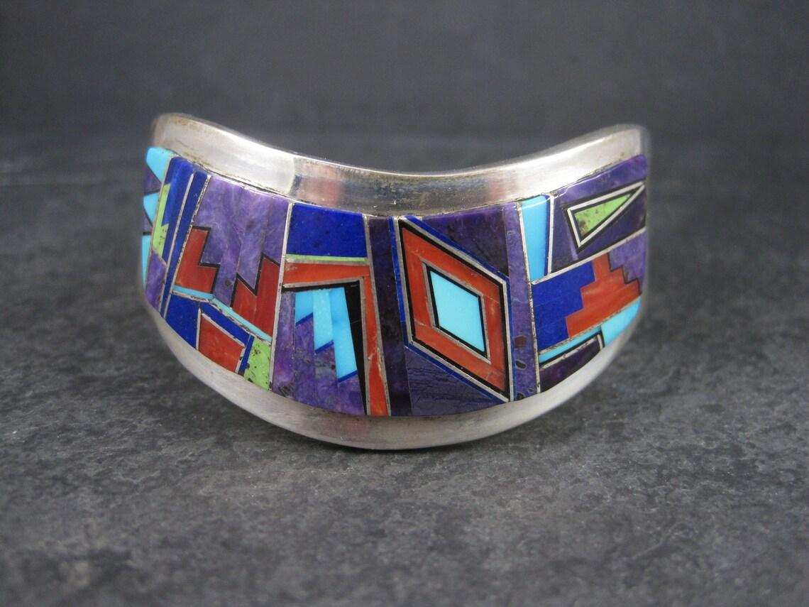 This stunning Native American bracelet is the product of the talented Navajo silversmith Edward Becenti.

This type of bracelet, with its curved design is called a 