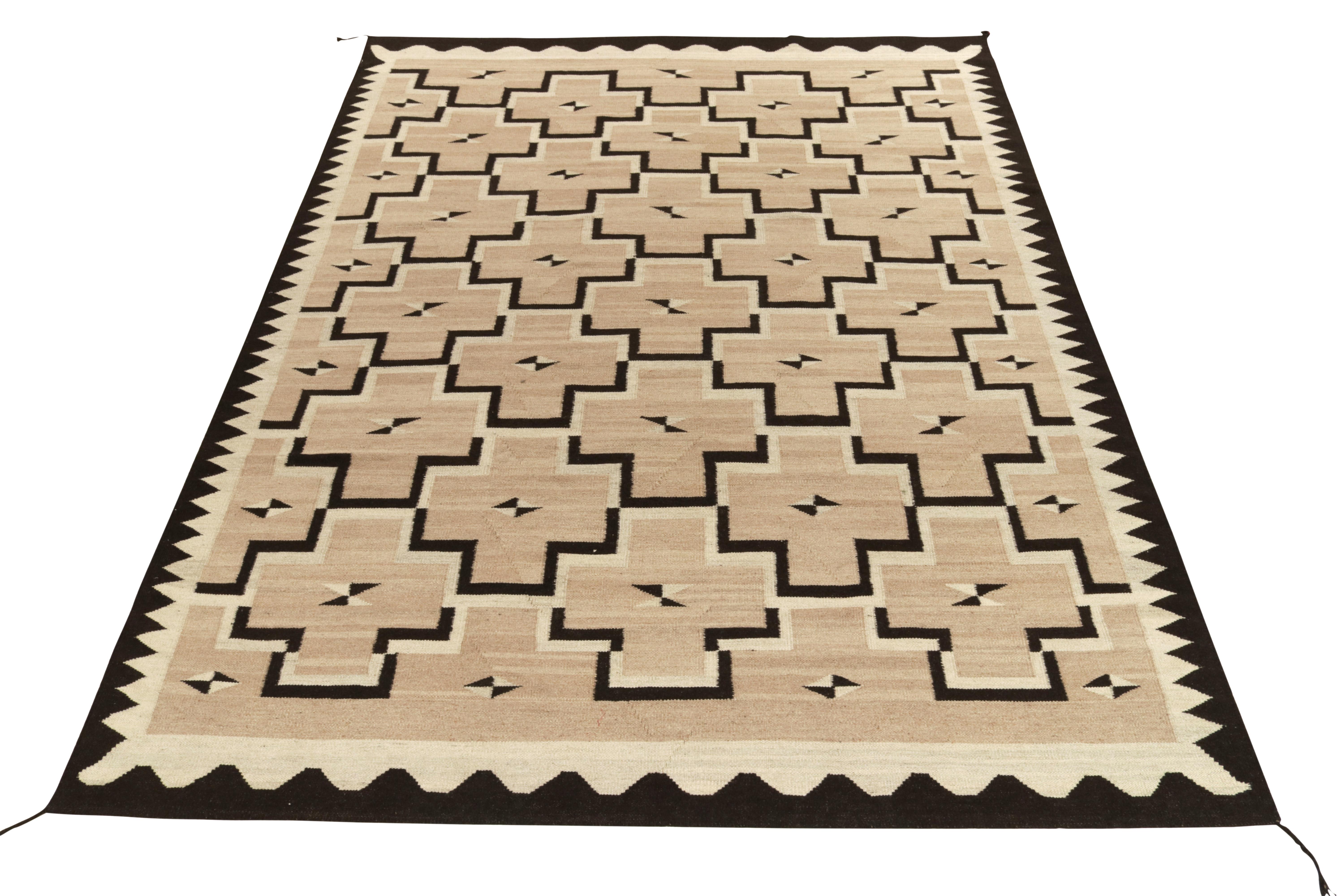 Handwoven in fine quality wool, a spacious 9x12 ode to the Navajo Kilim rug connoting the union of tribal & modern aesthetics. Inspired by the 1920s Navajo flatweaves in a modern approach, this rug showcases sharp geometric patterns in scintillating