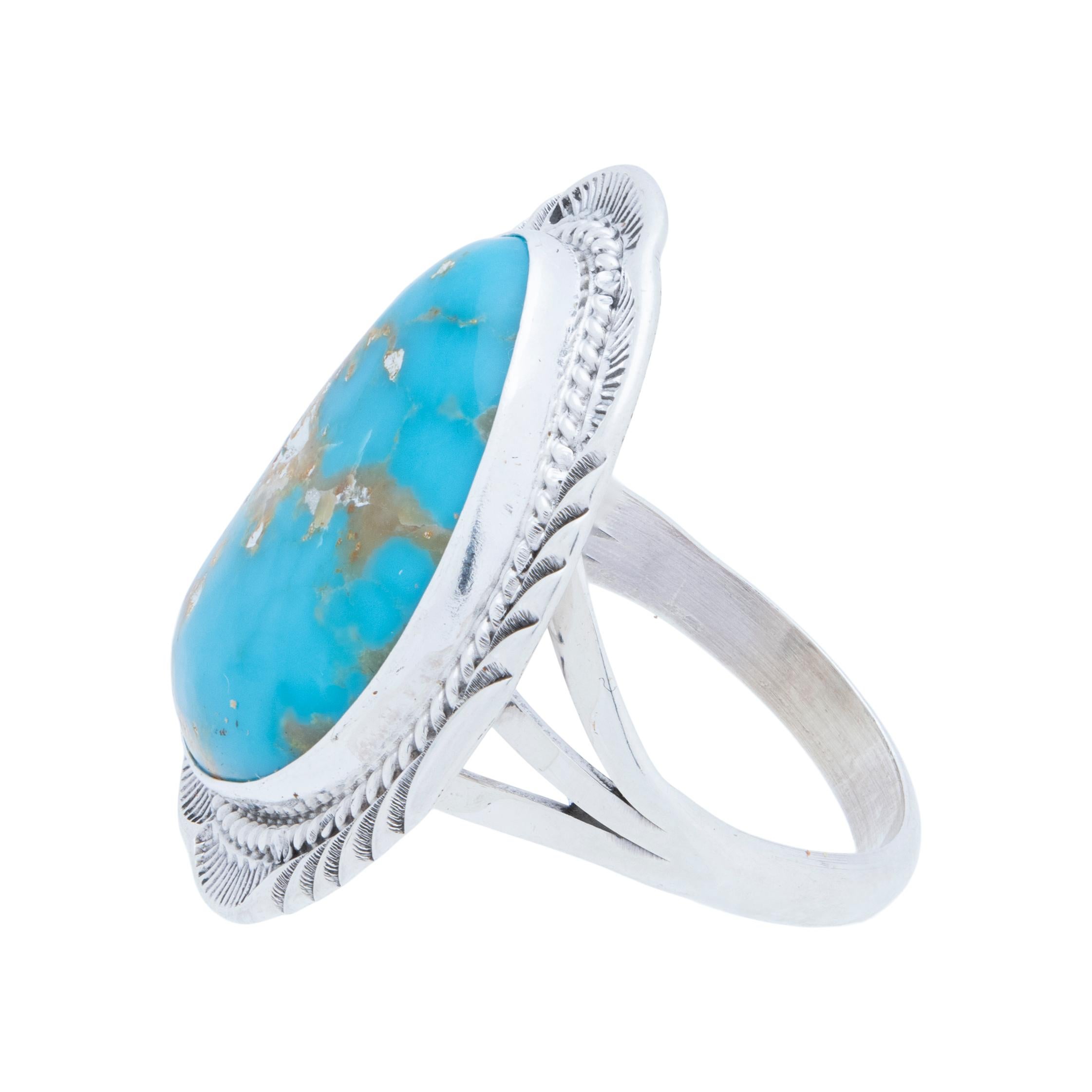 Navajo sterling silver and Kingman turquoise ring. Natural, untreated stone atop a classic twisted rope border with slash marks and hand stamped palmettes. Made by Navajo Silversmith W. Will Denetdale and stamped 