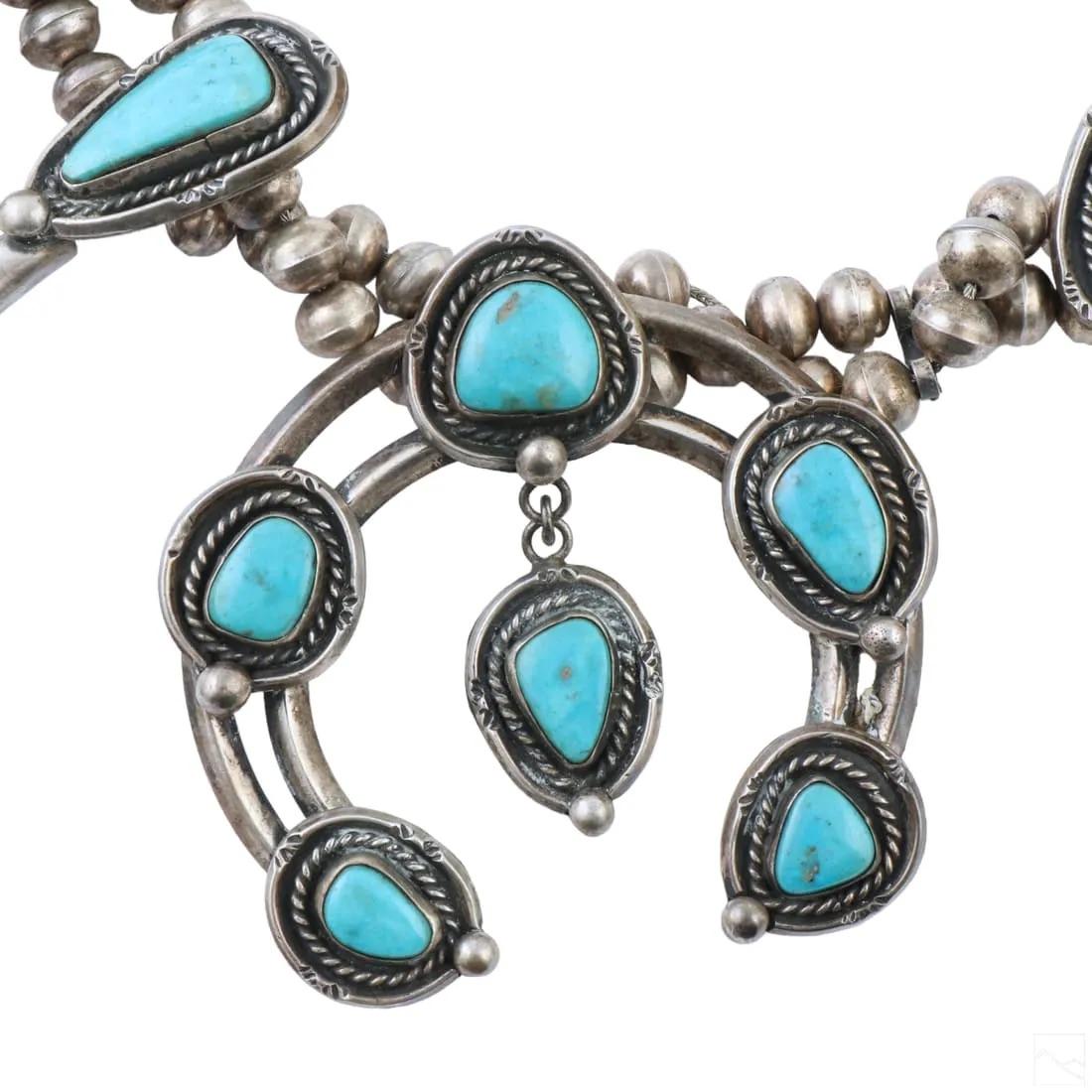 Old pawn vintage Southwest Navajo Indian sterling silver turquoise squash blossom necklace. No apparent makers mark. Features bench beads, with hook closure, 11 turquoise set squashes, measuring approximately 1