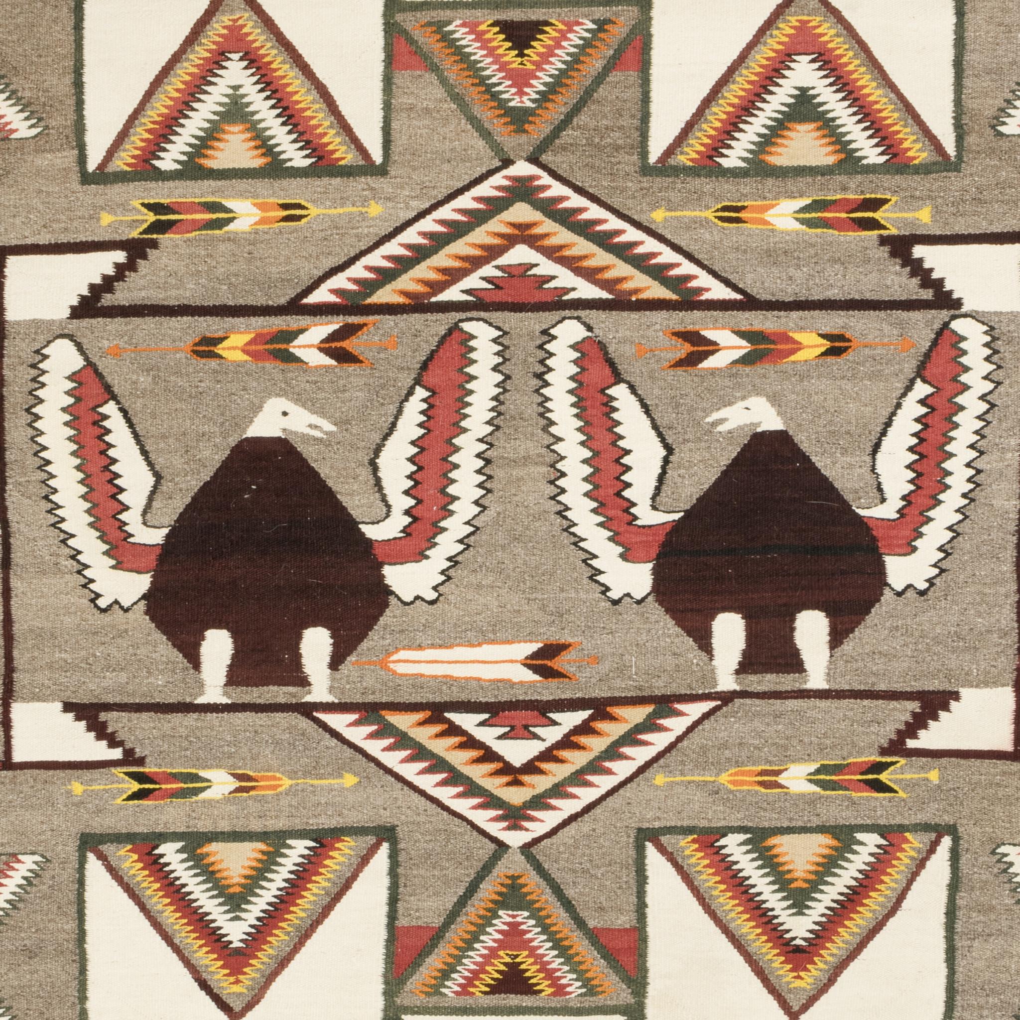 Native American Navajo Indian Red Mesa outline pictorial weaving featuring two pleasantly plump bald eagles facing each other. The birds are framed by a fine line rectangular box, which is surrounded by great Red Mesa and Teec Nos Pos elements. A