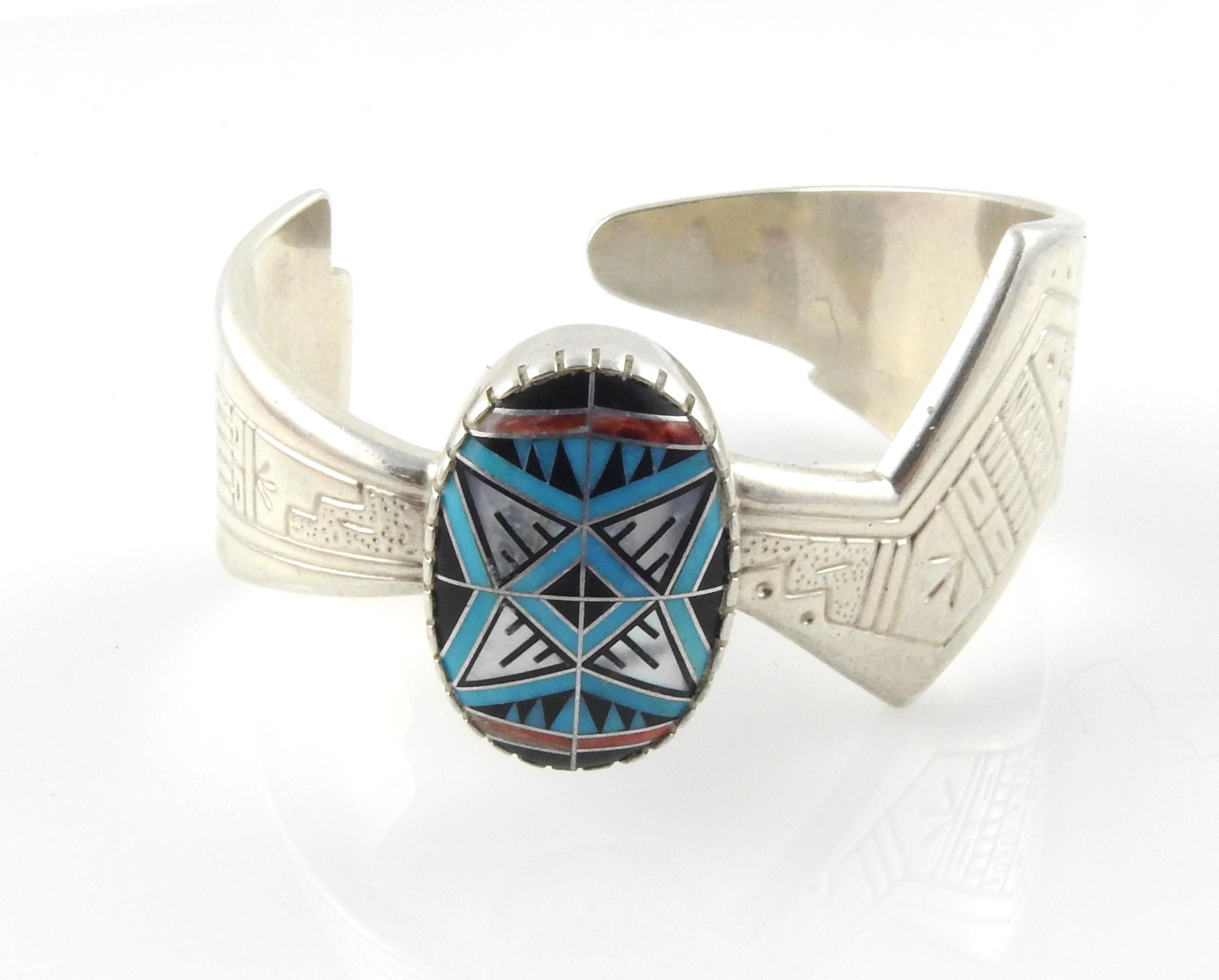 Navajo RMT Sterling Silver Cuff Bracelet with Multi Stone Inlay

This is a wonderful vintage Navajo sterling silver cuff bracelet with multi-stone inlay with Turquoise/Coral/Black Onyx in Morning star cabachon shape measures designed by