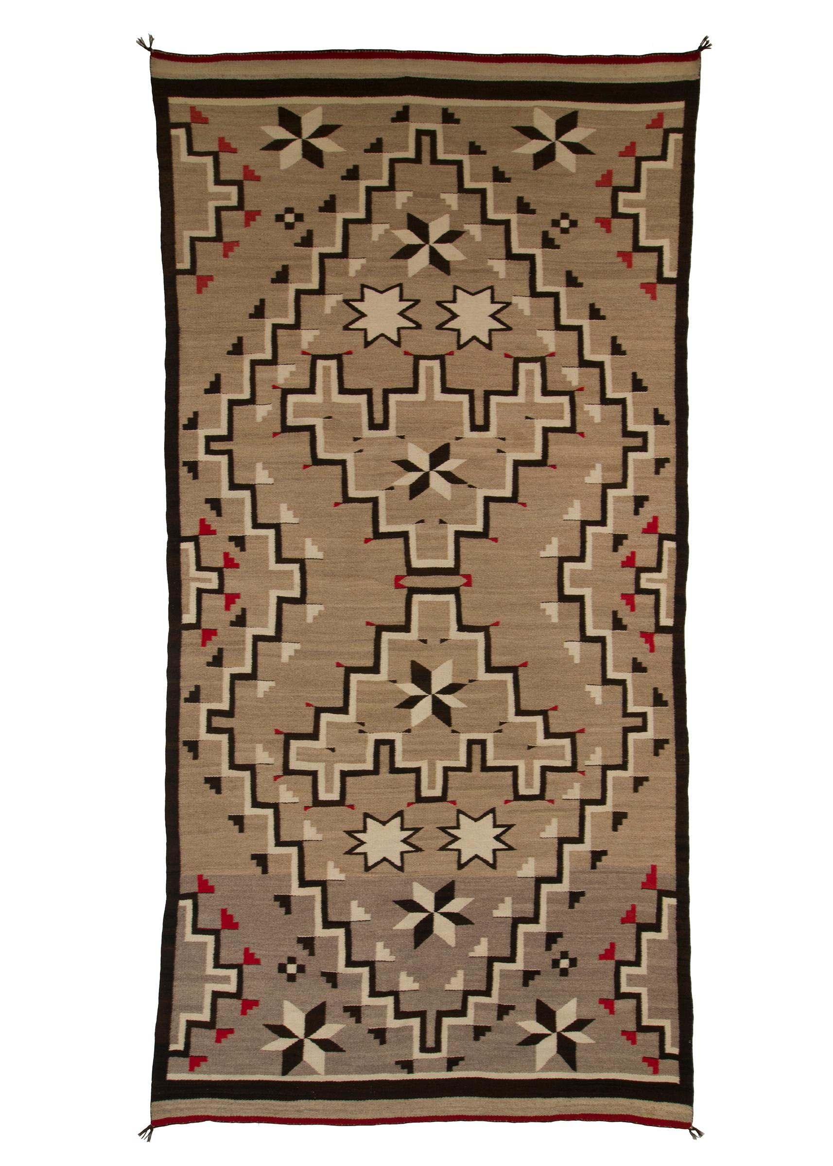 Navajo rug from the Trading Post Era, handwoven textile created in the 1920s-1940s, circa 1935. Woven of native hand-spun wool in natural fleece colors of gray/brown/tan with a geometric pattern in white/ivory, black/brown and red (dyed with