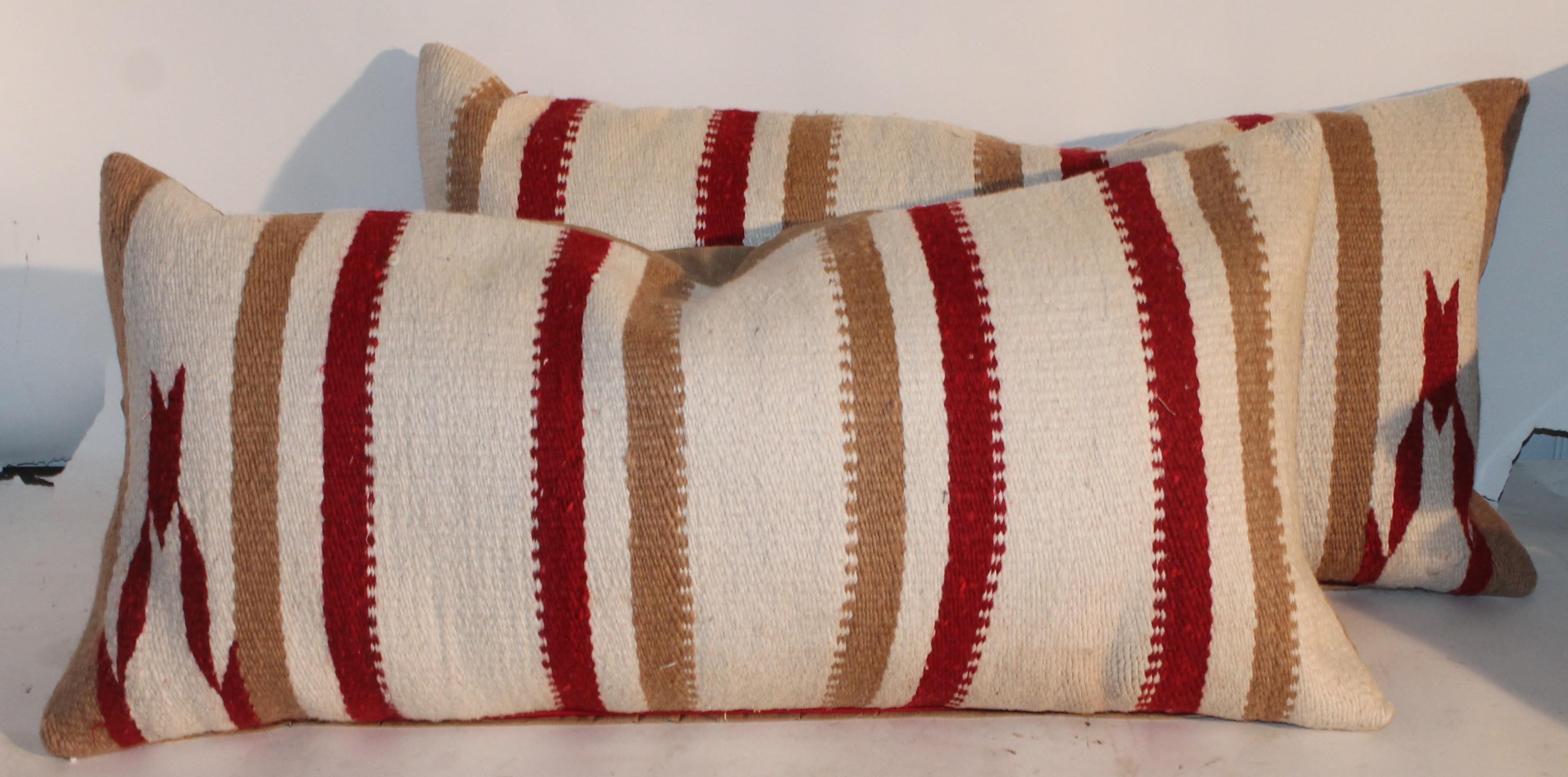 This fine pair of striped Navajo Indian weaving saddle blanket pillows are in great condition.