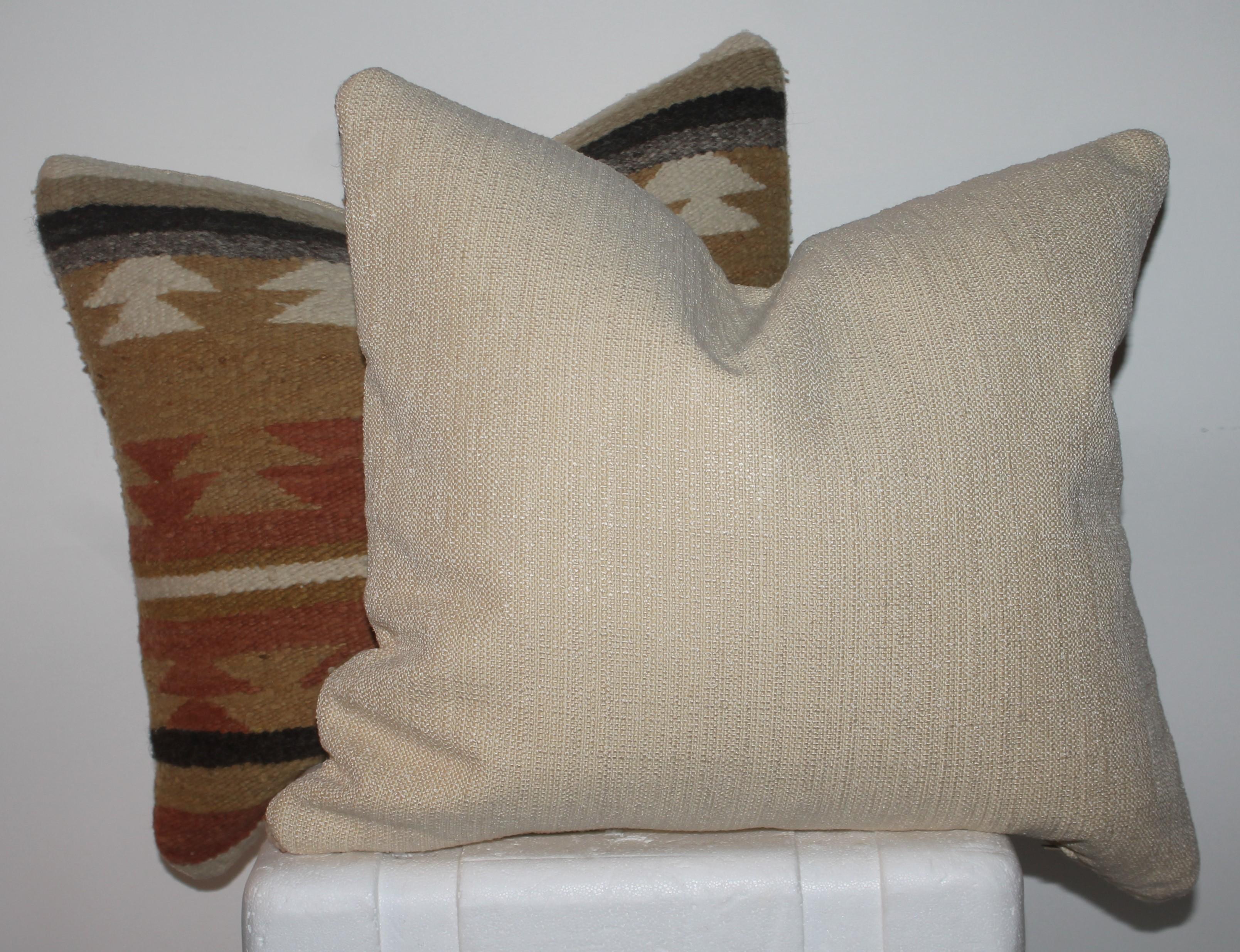 These fine handwoven Navajo Indian weaving pillows are in pristine condition and have cotton linen backings. The inserts are down & feather fill.