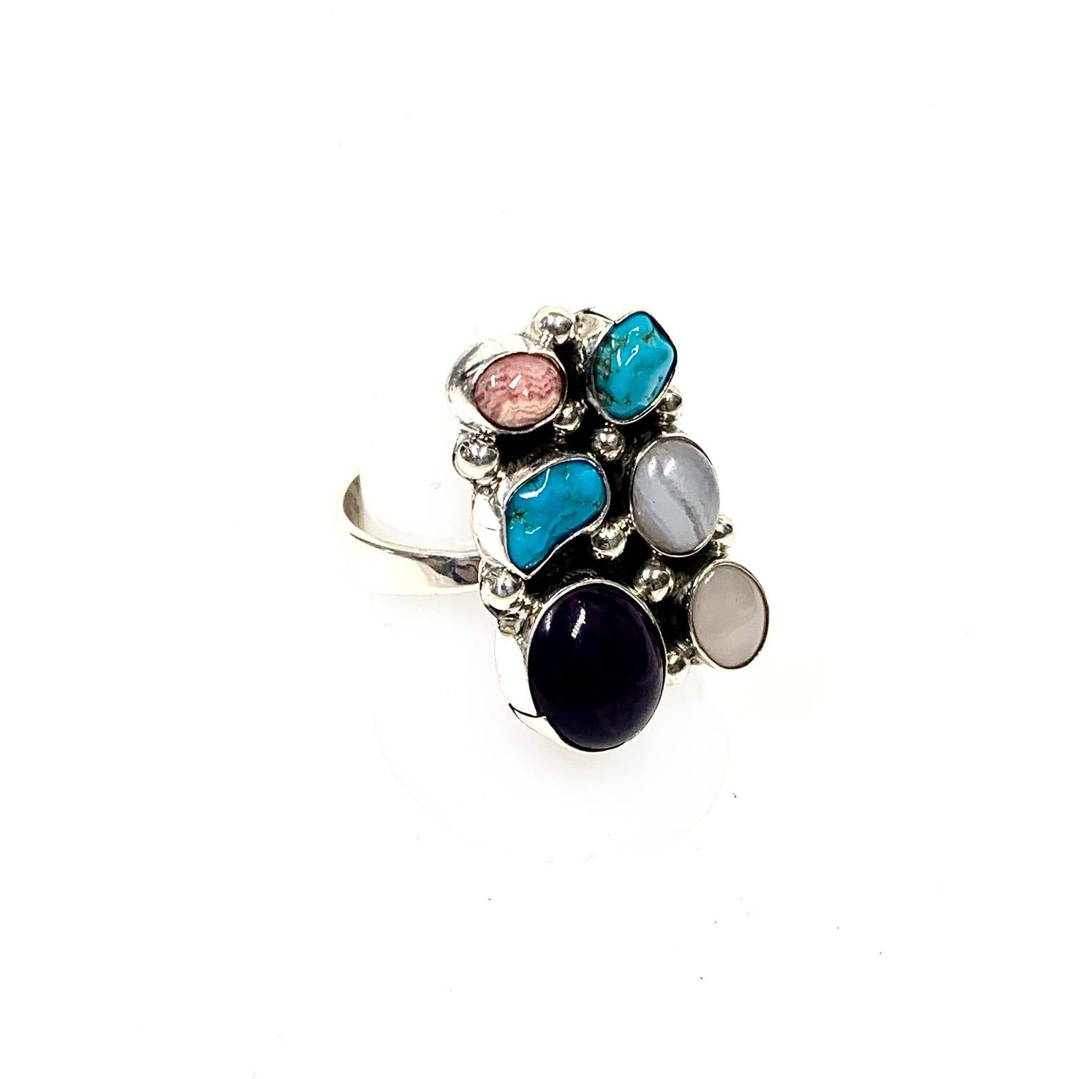 DC Navajo Sterling Silver 12 Gr. Multi Stone Ring CCRS23

New Vintage Navajo Ring adorned with Salmon Coral, Turquoise, Mother Pearl, Onyx, Opal Morado stones handcrafted by the renowned artist DC

•Measurements: 1.15 x 0.7 inches

•Weight: 12