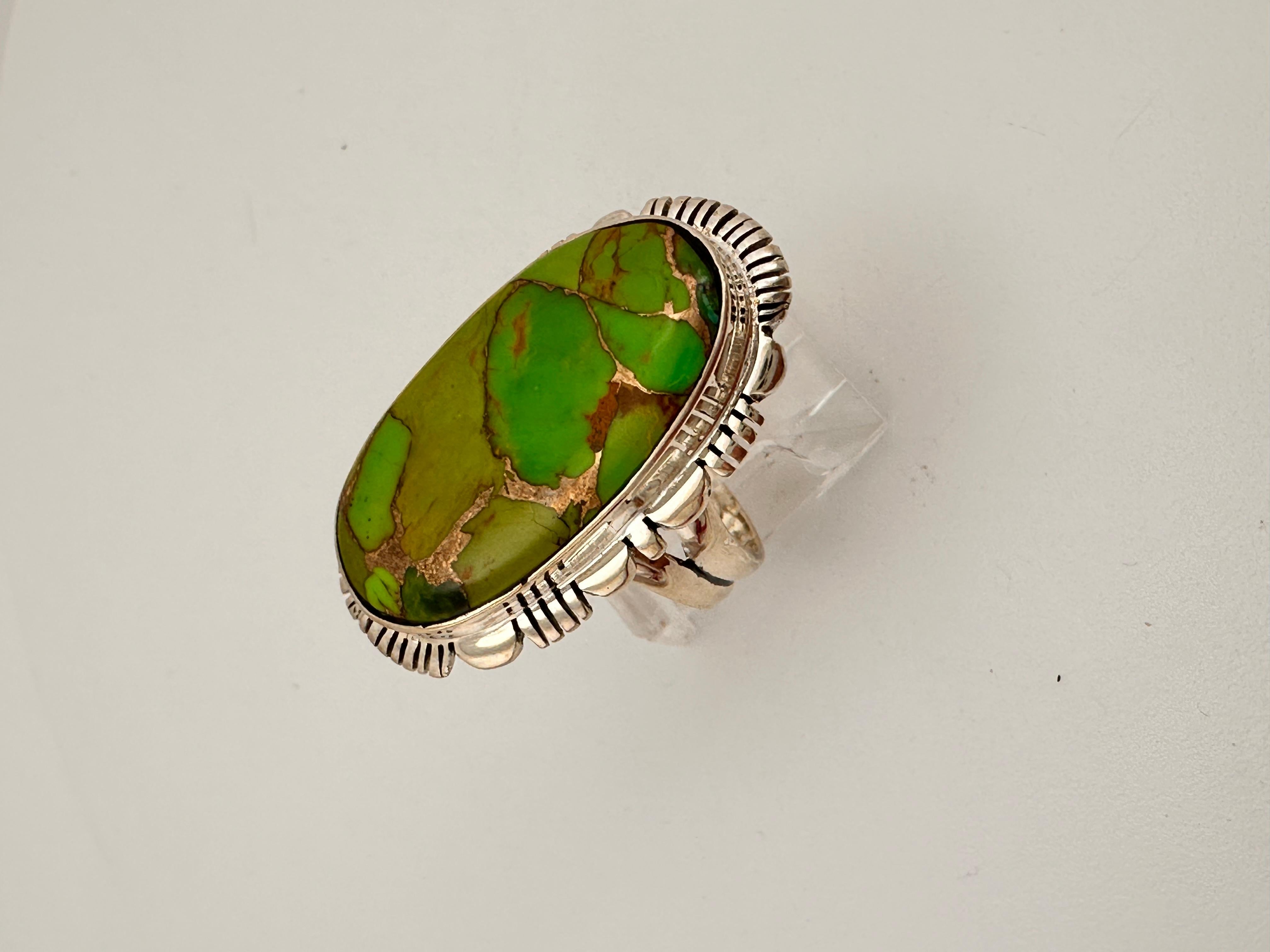 Navajo Sterling Silver .925 Green Turquiose 20mm x 33mm Oval Ring 
stone measures 15mm x 28mm
Size 10
Navajo artist Silver Star


Turquoise, a blend of the color blue and the color green, has some of the same cool and calming attributes. The color