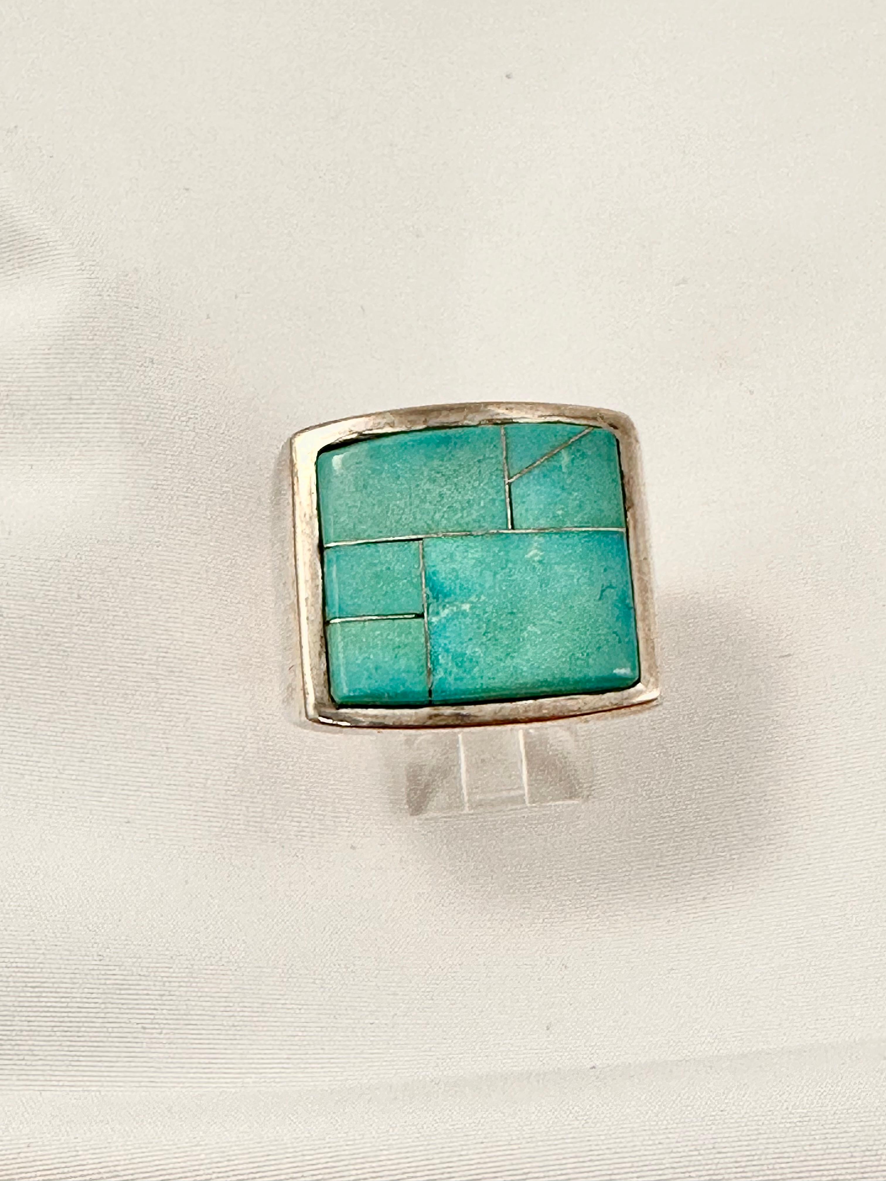Heavy mens Navajo Sterling Silver .925 Inlay Kingman Turquoise 25mm x 21mm Rectangle Ring 
Size 12.25
Navajo artist Ray Jack

Vibrant blue in color...photos don't show it well 


Turquoise, a blend of the color blue and the color green, has some of
