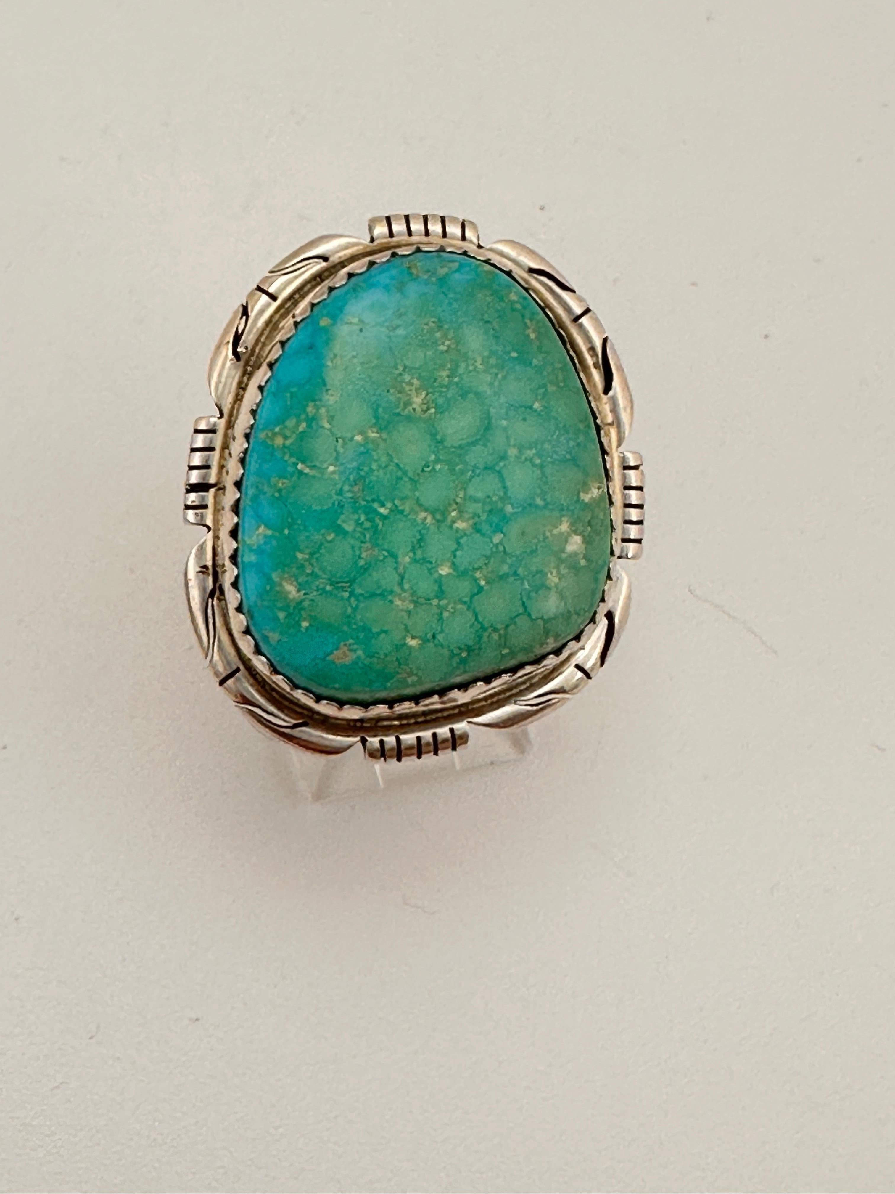 Navajo artist Pete Skeets Sterling Silver .925 Kingman Turquiose 24mm x 28mm Ring Sz 7 1/2
stone measures 20mm x 24mm

Turquoise, a blend of the color blue and the color green, has some of the same cool and calming attributes. The color turquoise is