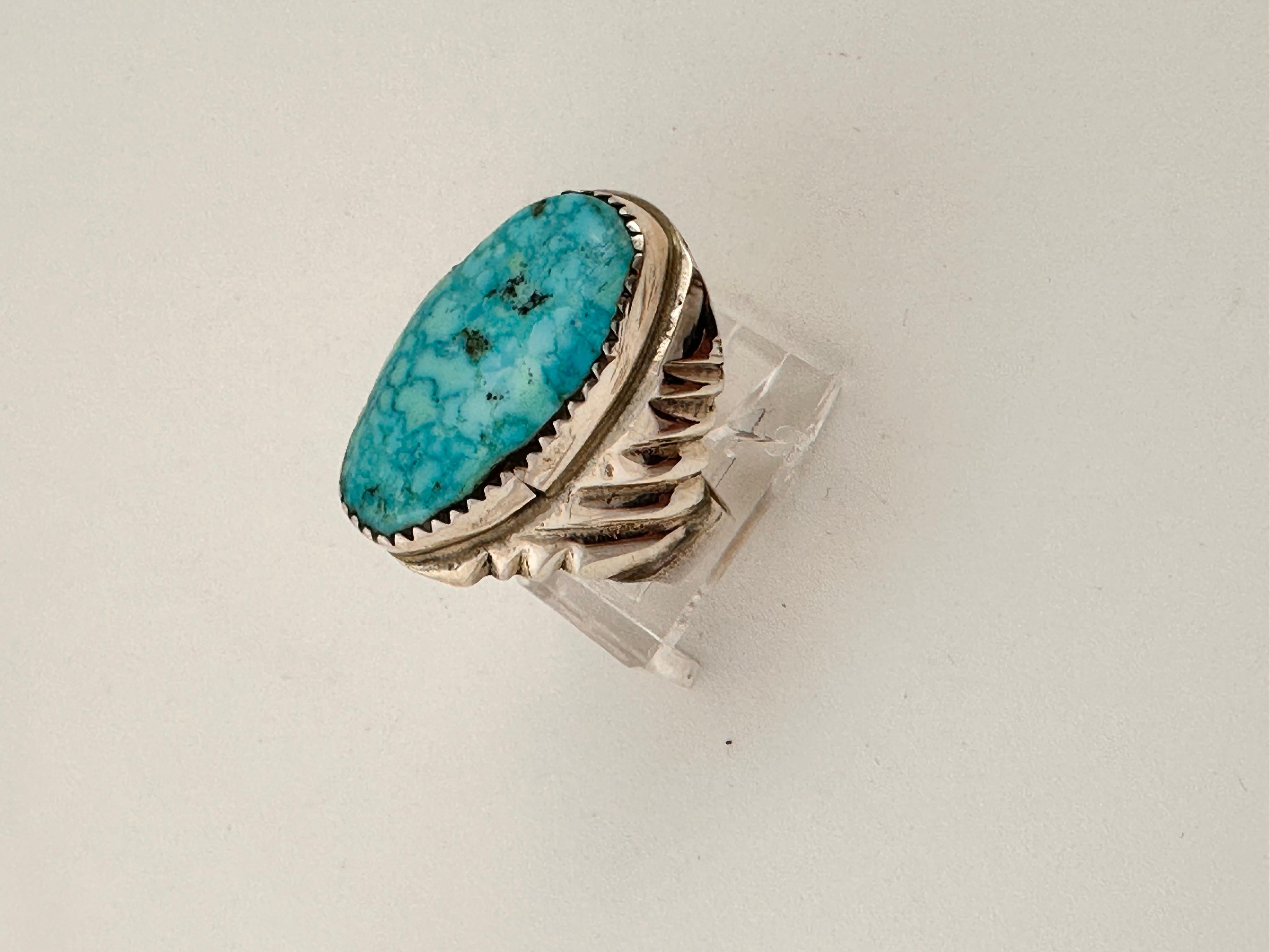 Navajo Sterling Silver .925 Kingman Turquiose 14mm x 25mm Oval Ring 
Size 9
Navajo artist Darren Chapo


Turquoise, a blend of the color blue and the color green, has some of the same cool and calming attributes. The color turquoise is associated