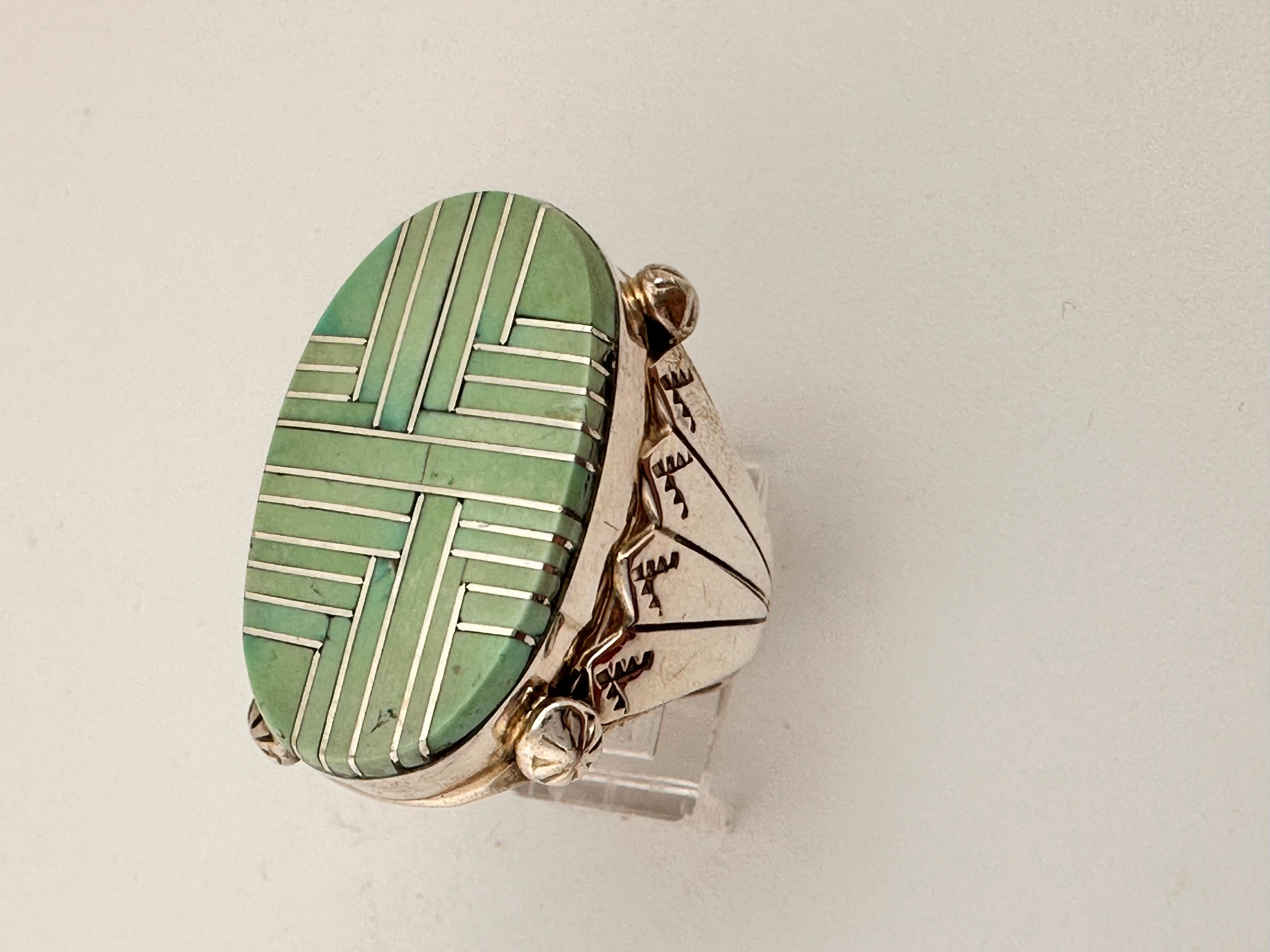 Heavy mens Navajo Sterling Silver .925 Inlay Kingman Turquoise 20mm x 32mm Oval Ring 
Size 12
Navajo artist Wilson Dawes


Turquoise, a blend of the color blue and the color green, has some of the same cool and calming attributes. The color