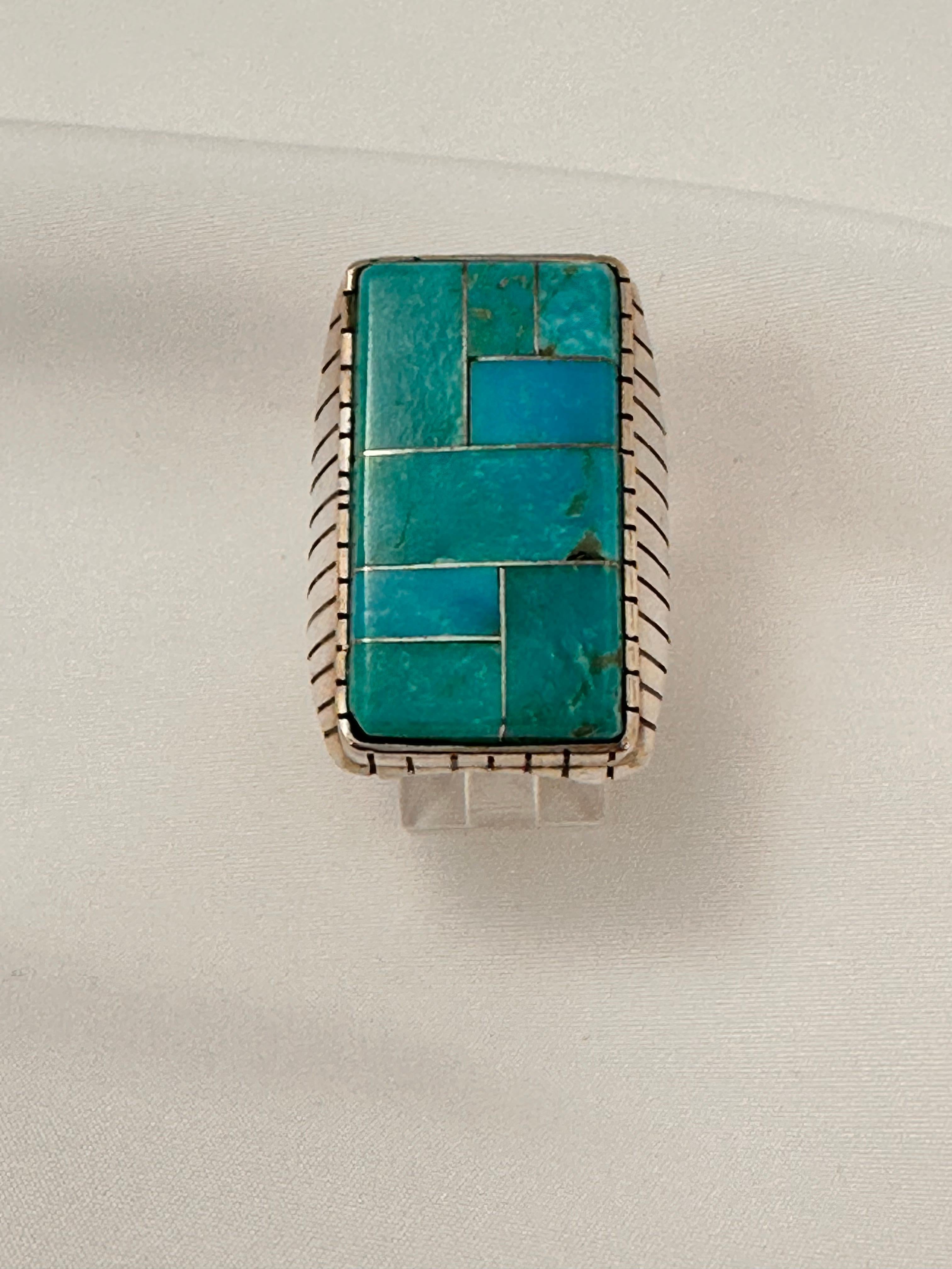 Heavy mens Navajo Sterling Silver .925 Inlay Kingman Turquoise 18 x 32mm Rectangle Ring 
Size 10.5
Navajo artist Ray Jack


Turquoise, a blend of the color blue and the color green, has some of the same cool and calming attributes. The color