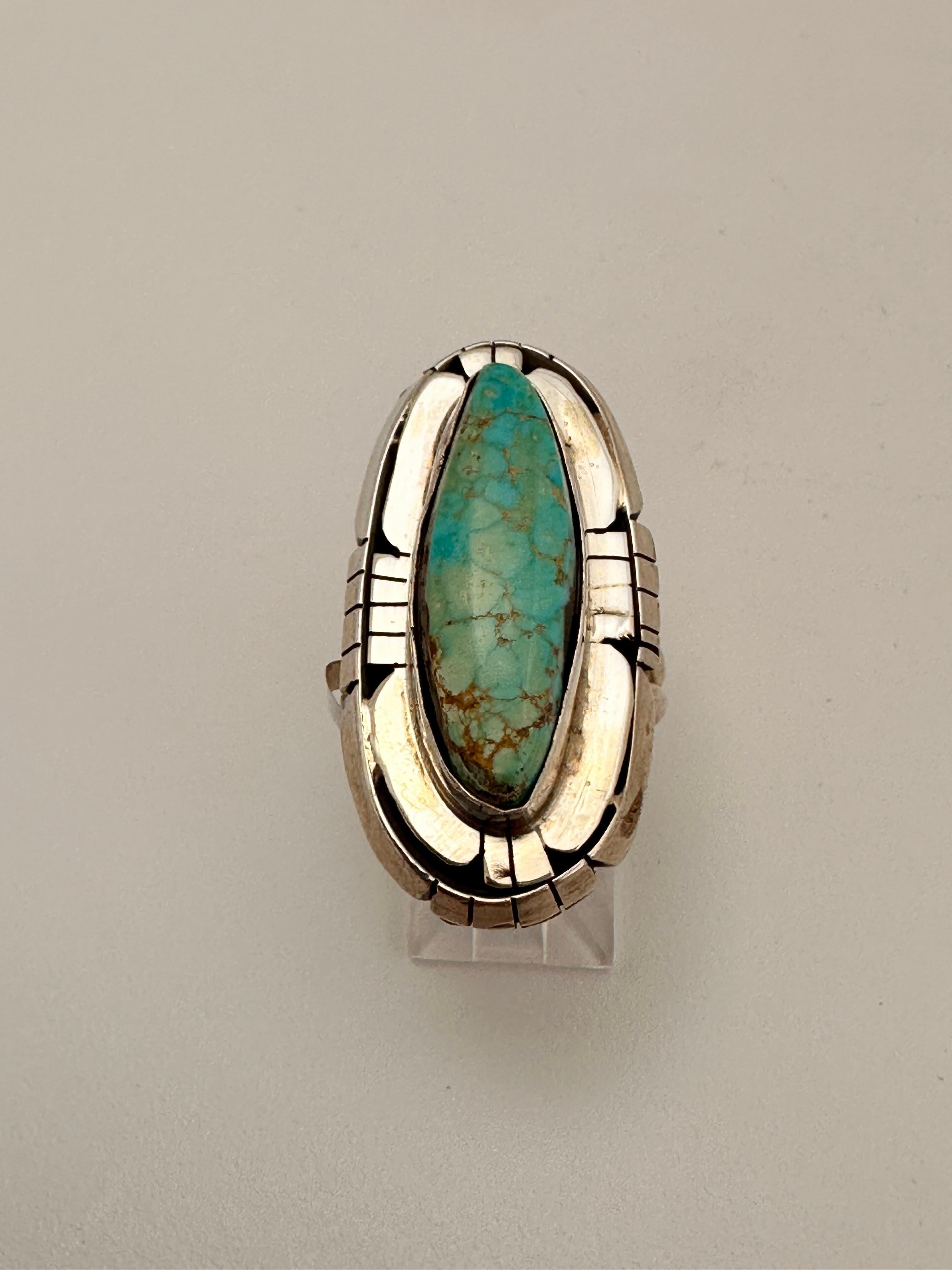 Navajo artist Betta Lee Sterling Silver .925 Kingman Turquoise 19mm x 37mm Oval Ring Size 8.5

Stone measures 10mmx 27mm

Turquoise, a blend of the color blue and the color green, has some of the same cool and calming attributes. The color turquoise