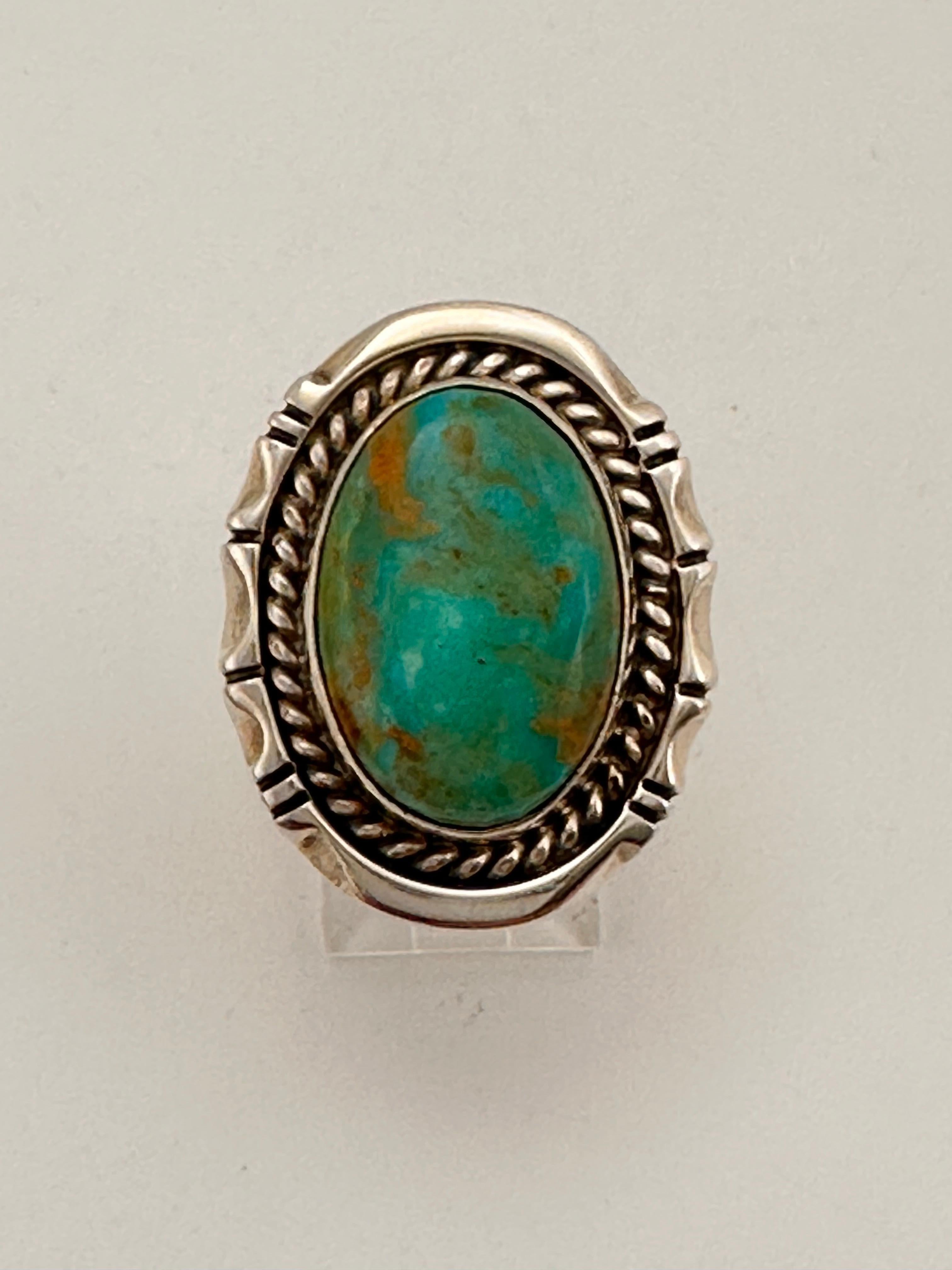 Navajo Sterling Silver .925 Kingman Turquiose 22mm x 28mm Oval Ring 
stone measures 14mm x 20mm
Size 8
Navajo artist Bill Mex ~ Dineh'


Turquoise, a blend of the color blue and the color green, has some of the same cool and calming attributes. The