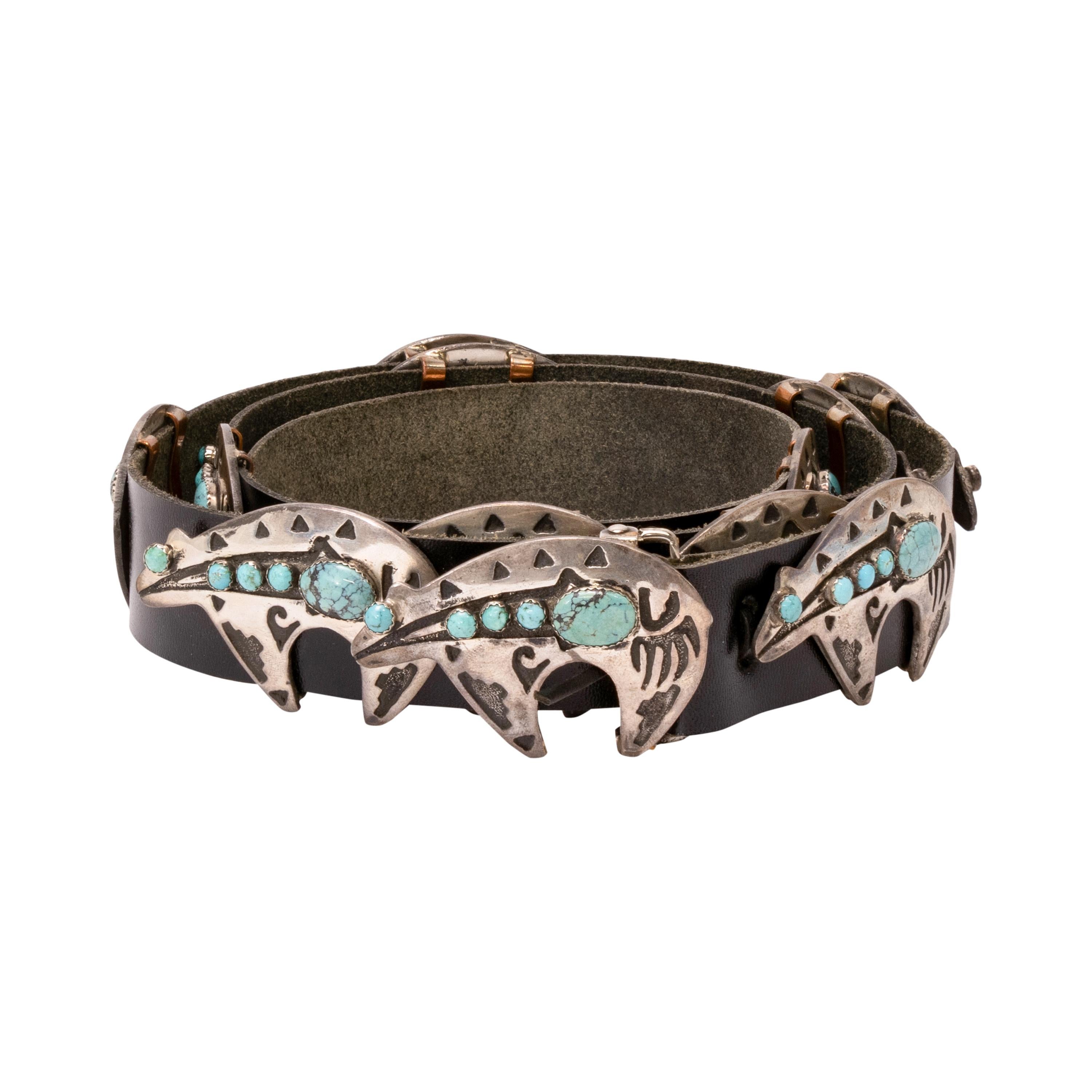 Navajo heartline bear sterling silver and turquoise concho belt. Twelve total conchos with matching buckle. Each concho in shape of bear with etched heartline and geometric designs, accented by three small and one large Kingman turquoise stones,