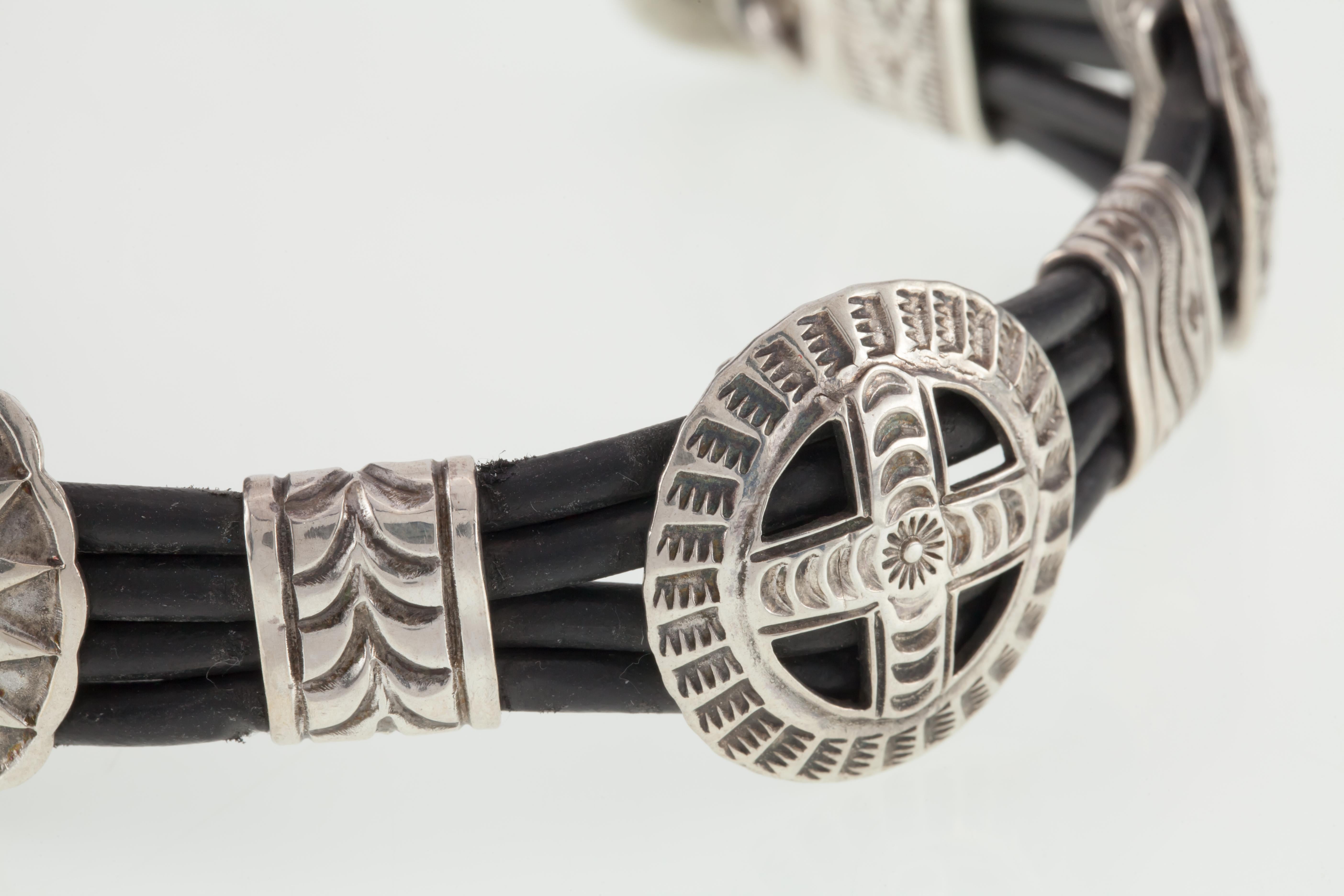 Gorgeous Navajo Sterling & Leather Bracelet
Features a Hand Stamp Design Solar Cross 
Width of Bracelet = 25 mm
Total Length = 7.25