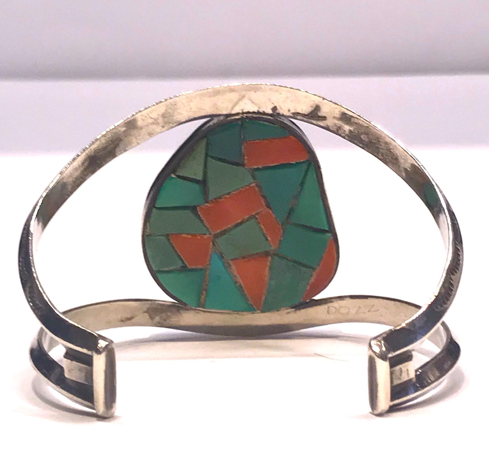 
This Navajo sterling silver wire cuff bracelet, circa 1970, is beautifully designed with an unexpected element of surprise and healing. Two decorated sturdy sterling wires support the large turquoise central stone. Each of the wire bands is