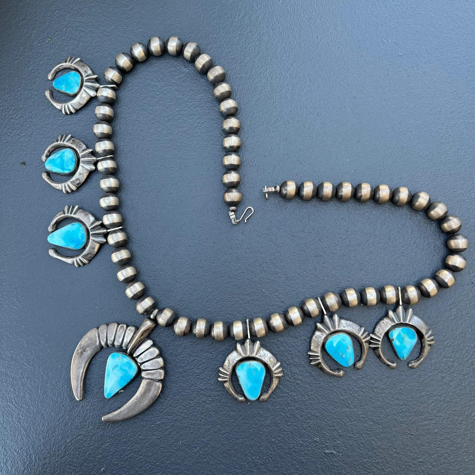 MASSIVE / Heavy Vintage Handcrafted by Navajo silversmith, Charles Johnson  oxidized sterling silver necklace with a strand of Navajo pearls, featuring a large naja in center and hanging smaller naja (3 on each side ) . All najas made of solid