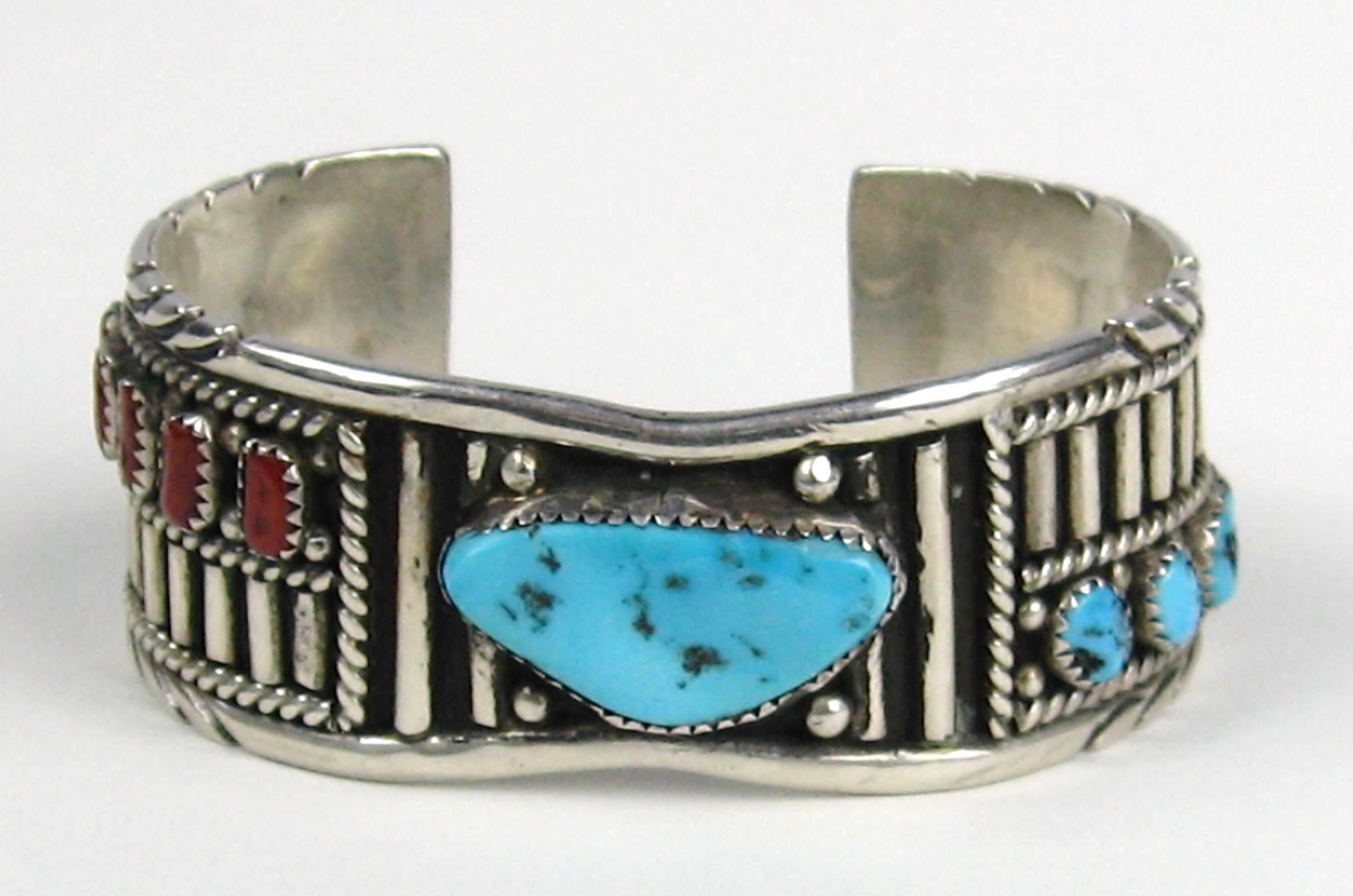 Navajo Old Pawn Sterling silver Cuff Mirrored image on both sides, one is bezel coral the other is bezel Turquoise. Measures .83 in the center and graduates up to .98 in, Will fit a 6.5 to 7 in wrist nicely. This is out of a massive collection of